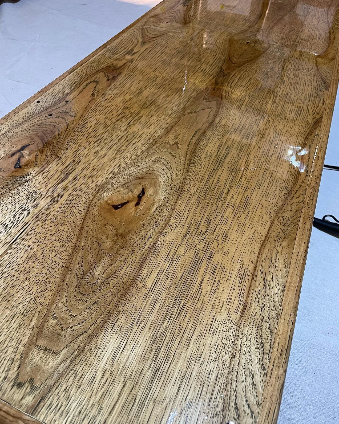 Once we had it stripped down and painted, it was time to seal it and get ready for service. Bowie helped papa seal the service area by applying the Glaze Coat. This will help prevent the wood from absorbing any spills, and create a nice shiny finish 