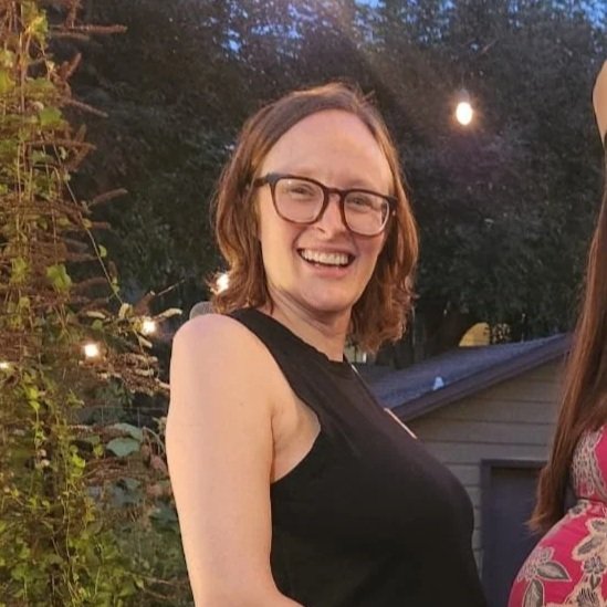 Mom in glasses smiling