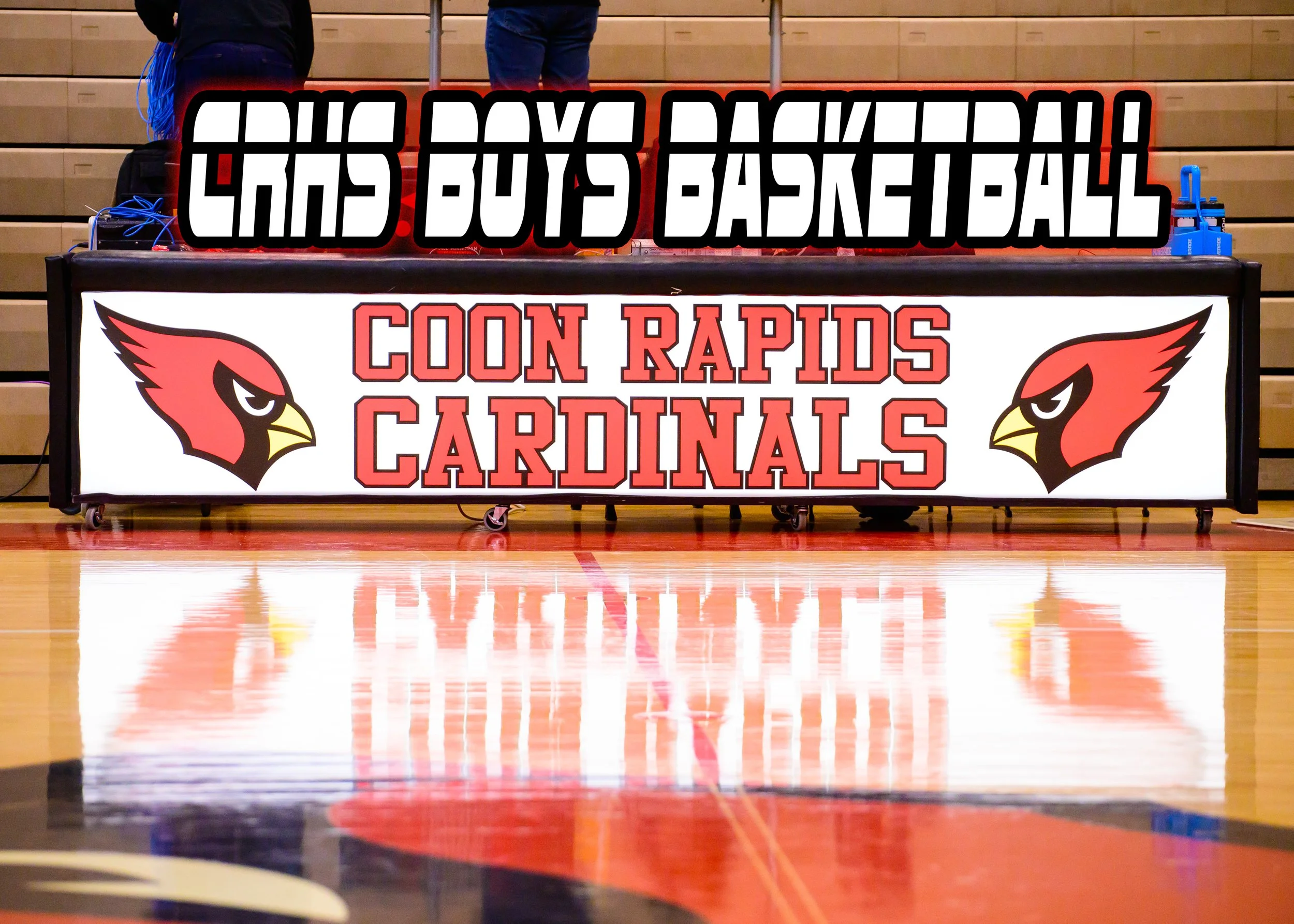 Male athlete in red uniform performing a three point shot