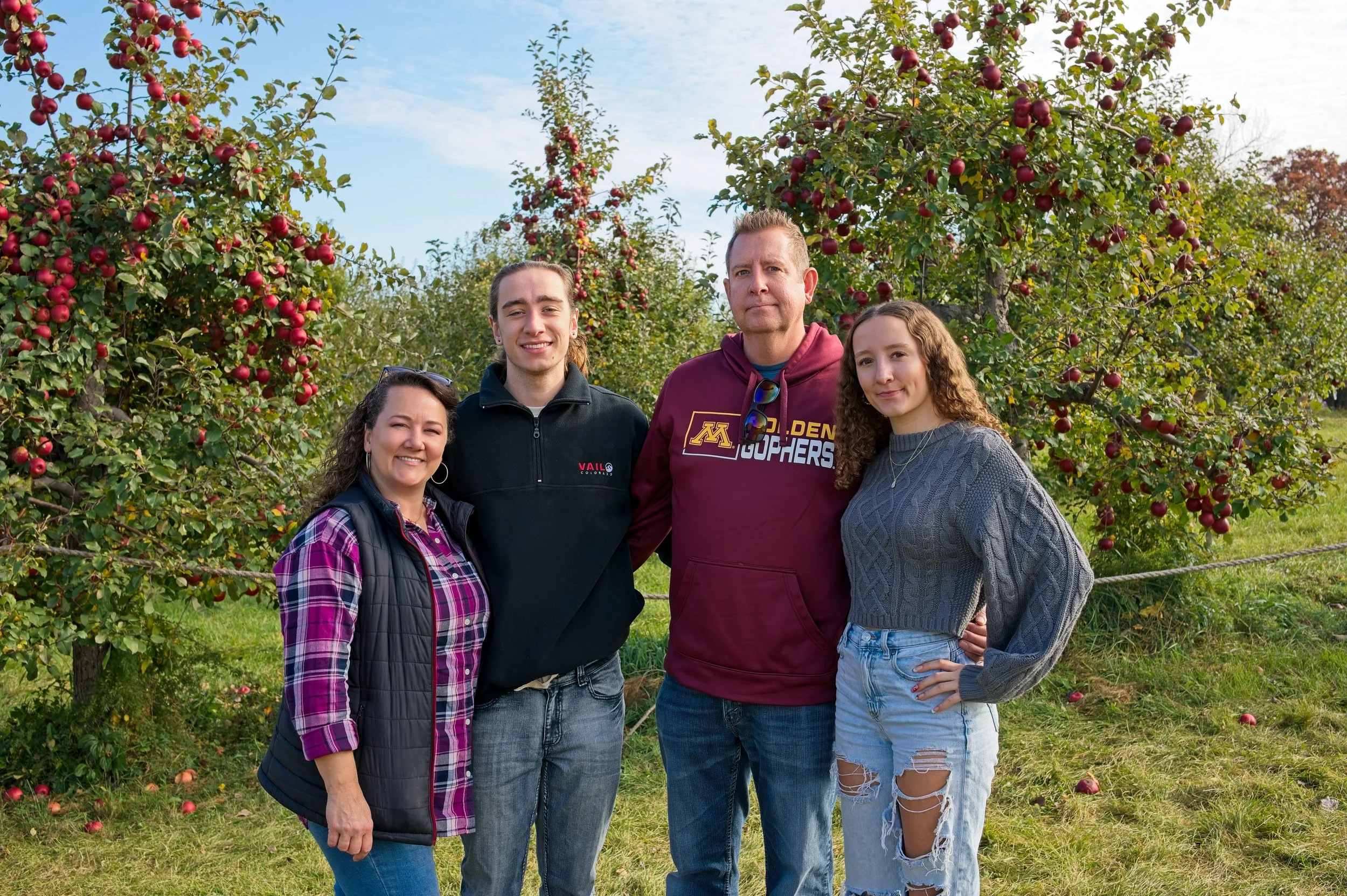 Jeni Barker's family at an apple orchard where Jeni points out a flaw about herself.