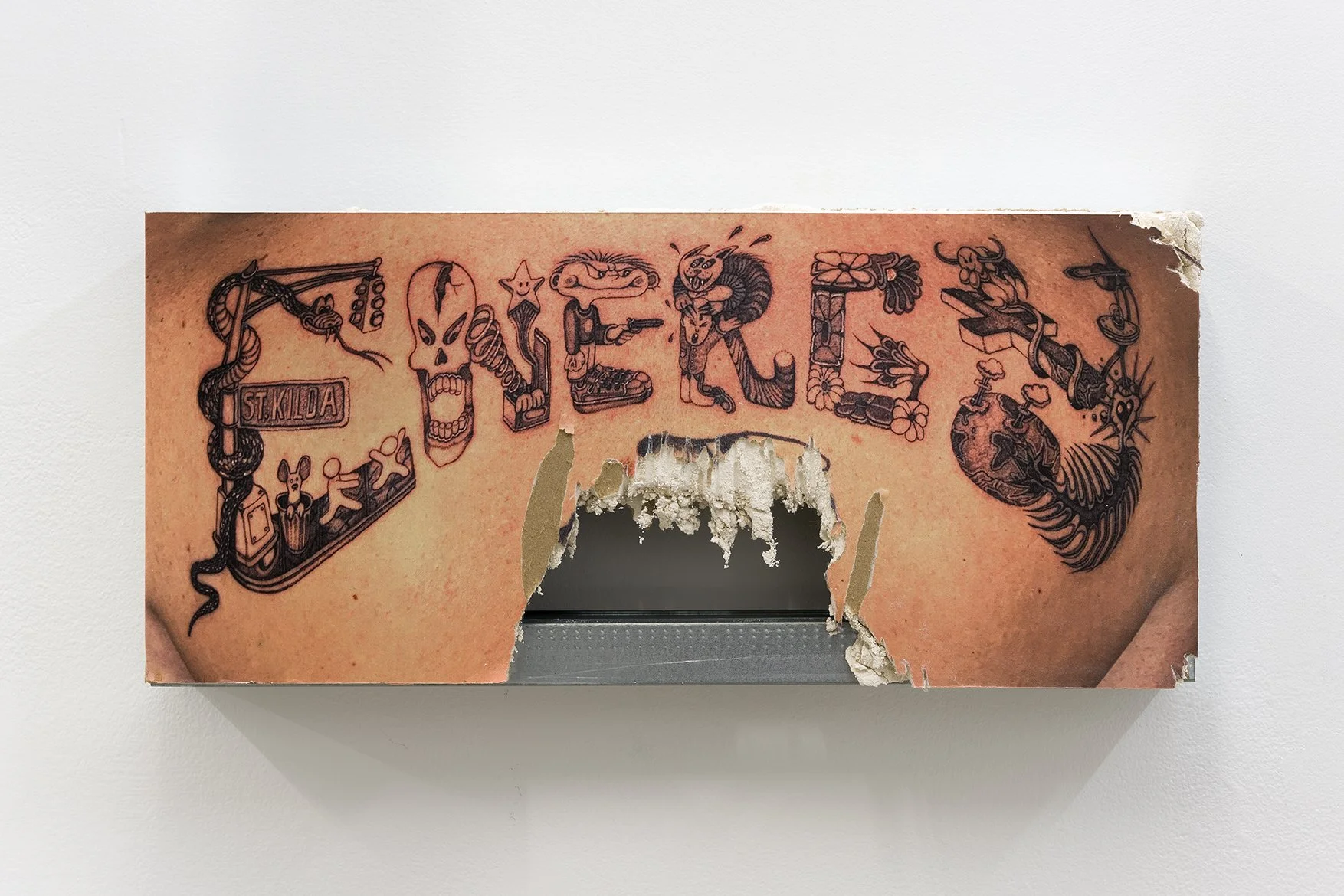 Emil Bognar Nasdor 
 Drywall Dreams: KDL editions: Fly Energy , UV print, liquid nails adhesive, self tapping screws, on drywall, mounted on stud, 9 x 20 x 3.25 in; tattoos by Keegan Dakkar L. Photographer: Stephen Faught