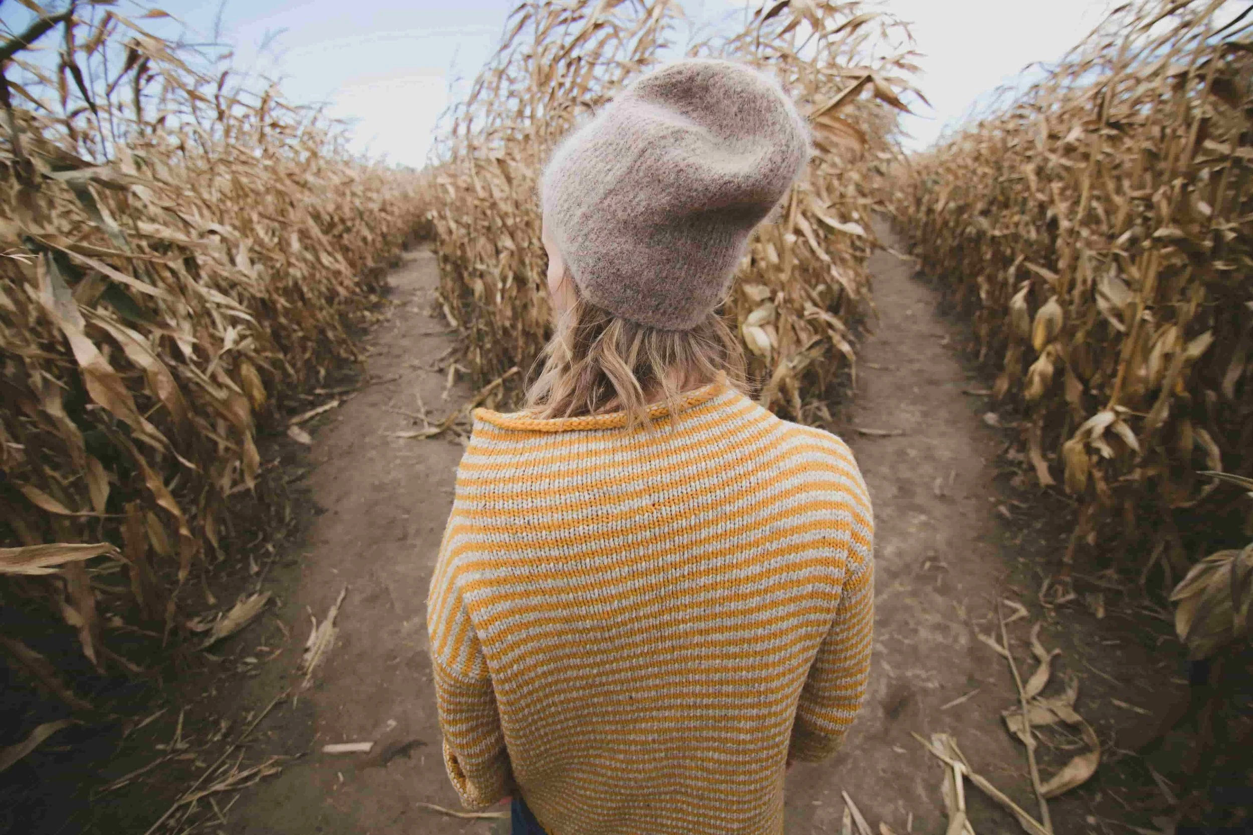 An image of a woman deciding which of two paths to take through a corn field. An analogy for anxiety and depression, two mental health challenges taking her in the same direction. But choosing which to treat is no longer a decision she needs to make.