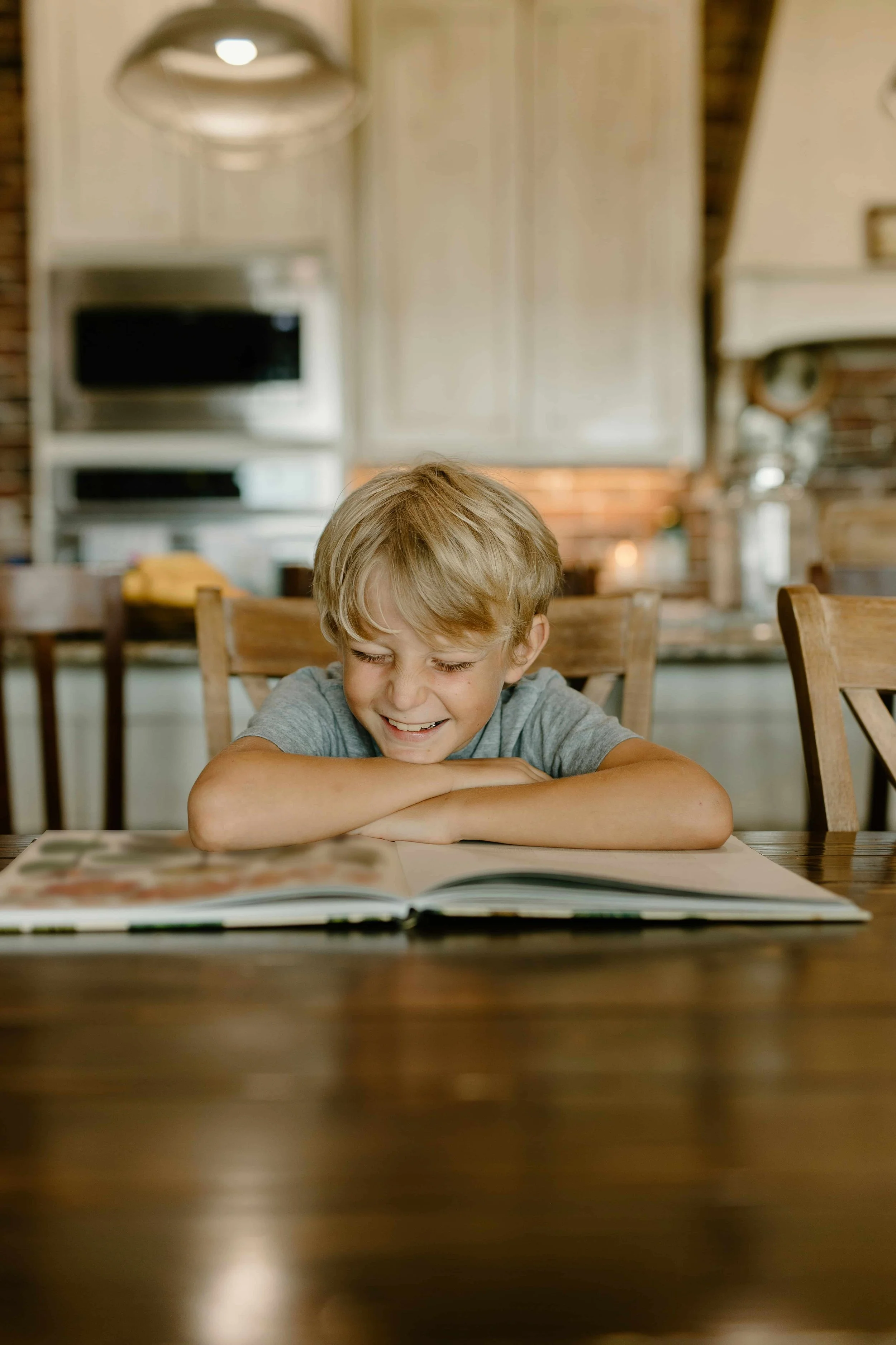 Image of a happy child reading a book. A depiction of a Tampa child therapy client