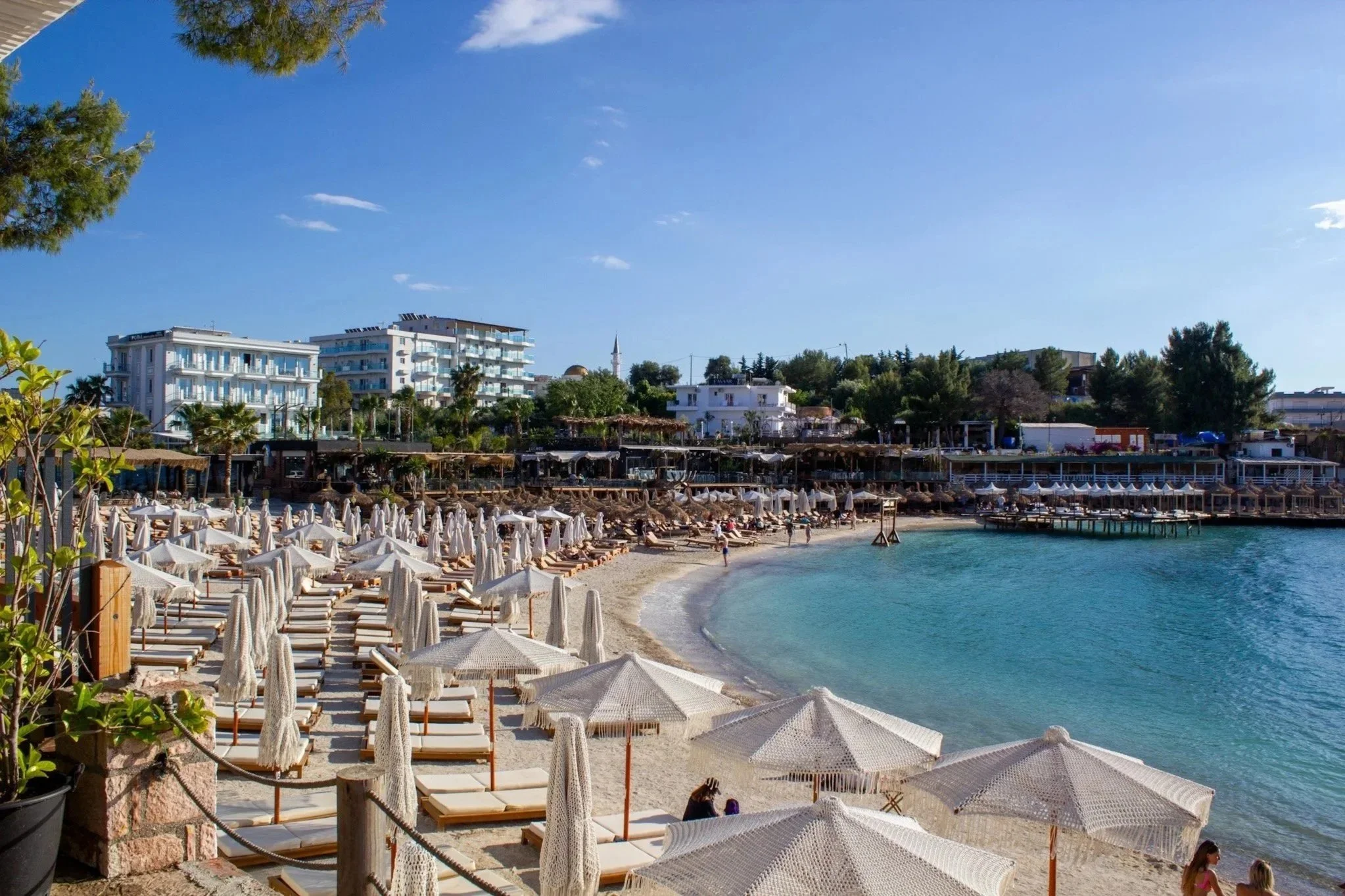 View of Ksamil Beach and sunbeds during the day