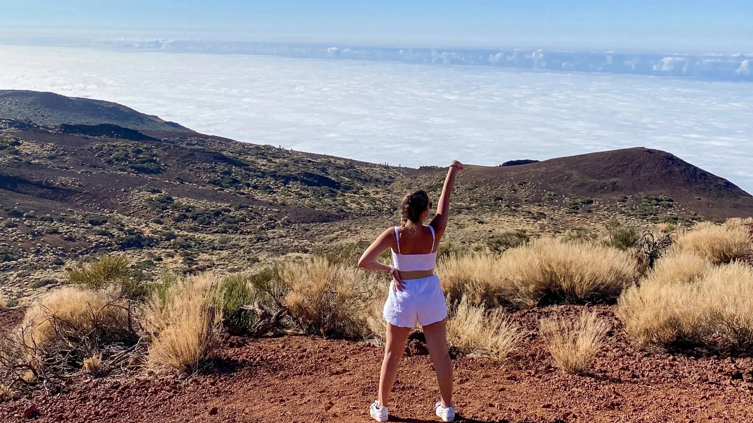 Carol on the top of Mount Teide with views of Tenerife over the clouds.jpg