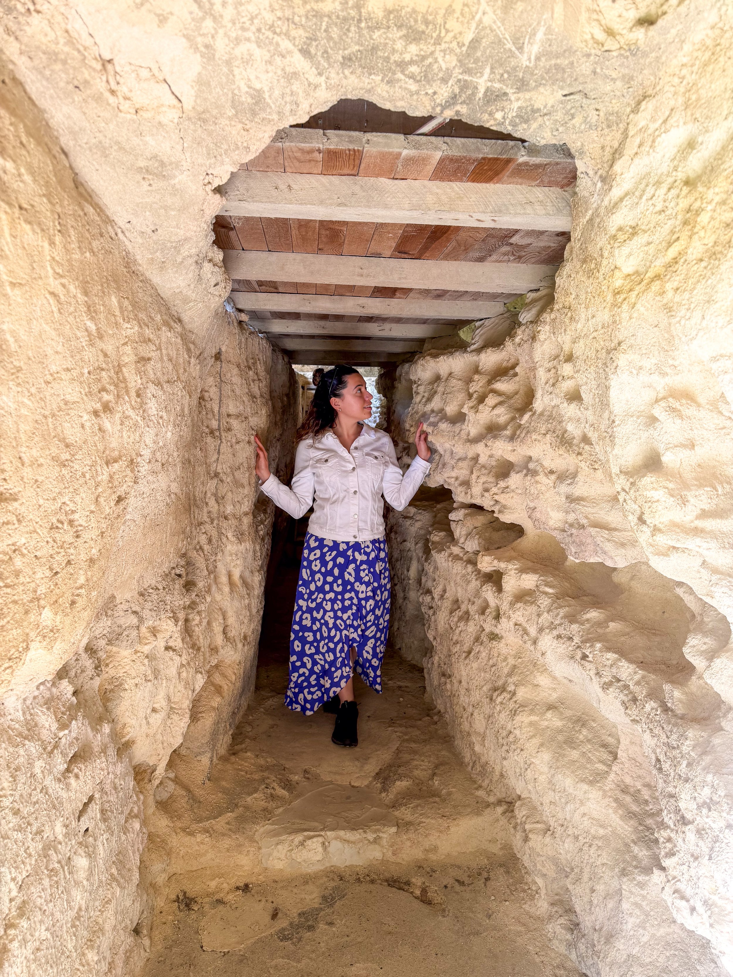 Carol passing through the narrow walls of Aladzha Monastery, Varna, Bulgaria