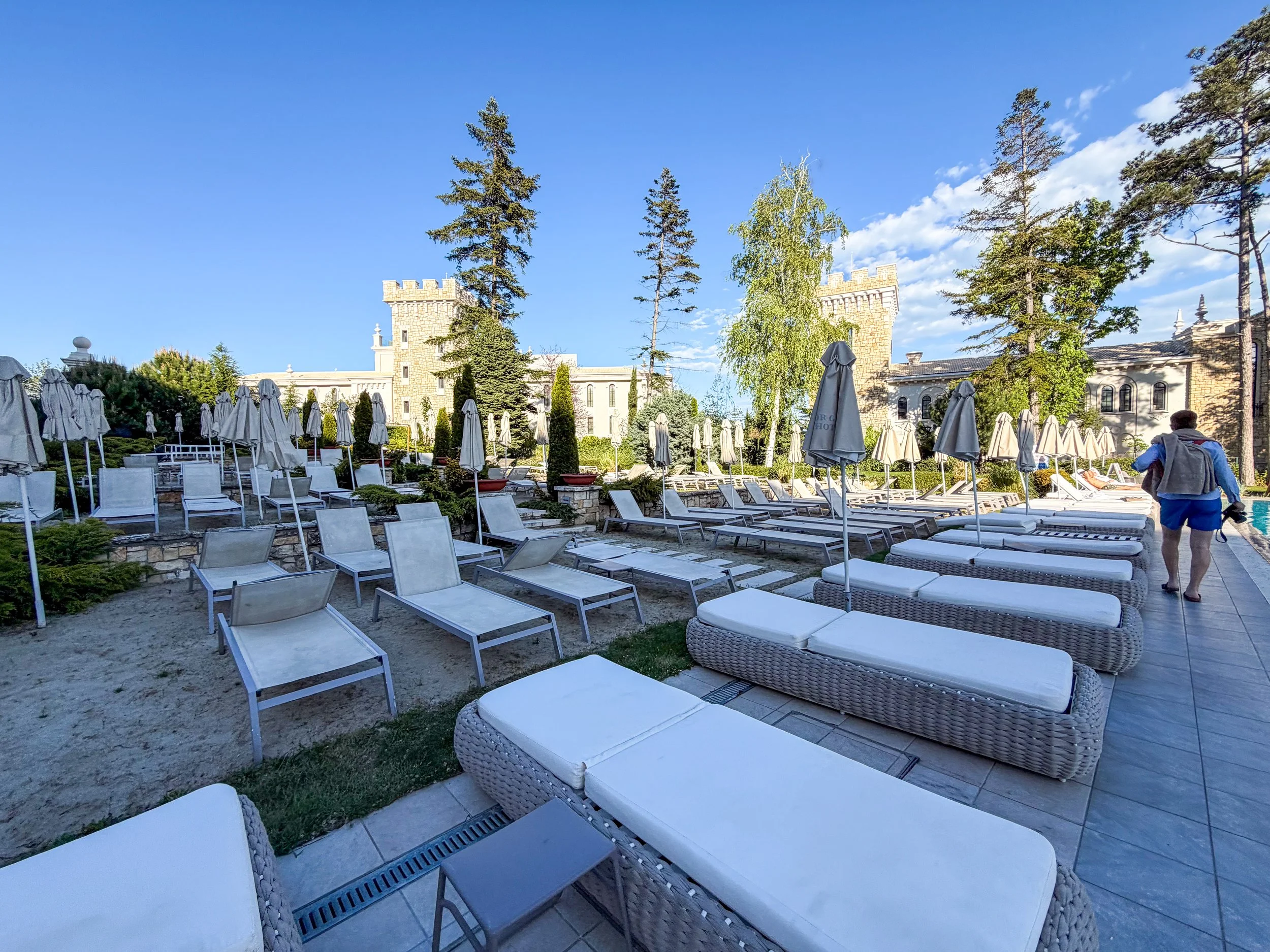 Astor Garden Hotel sunbed area next to pool.jpg