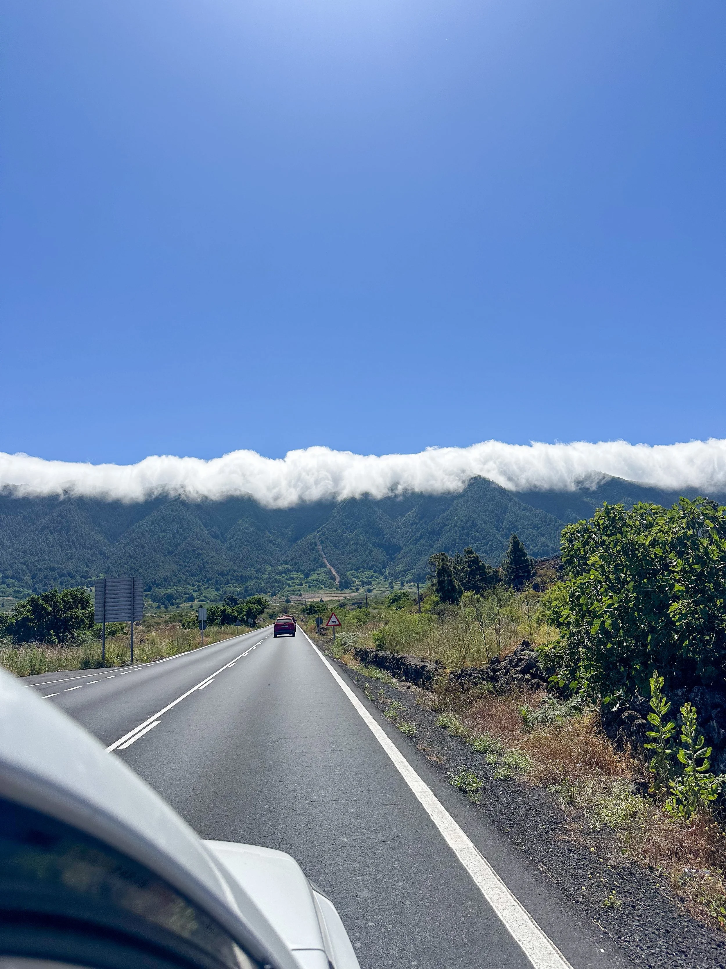 Clouds over the mountains in La Palma.jpg