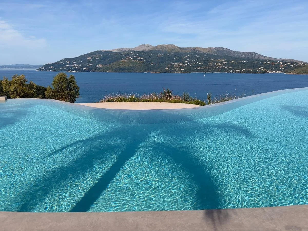 Arameras resort pool view with mountains in the background.jpg