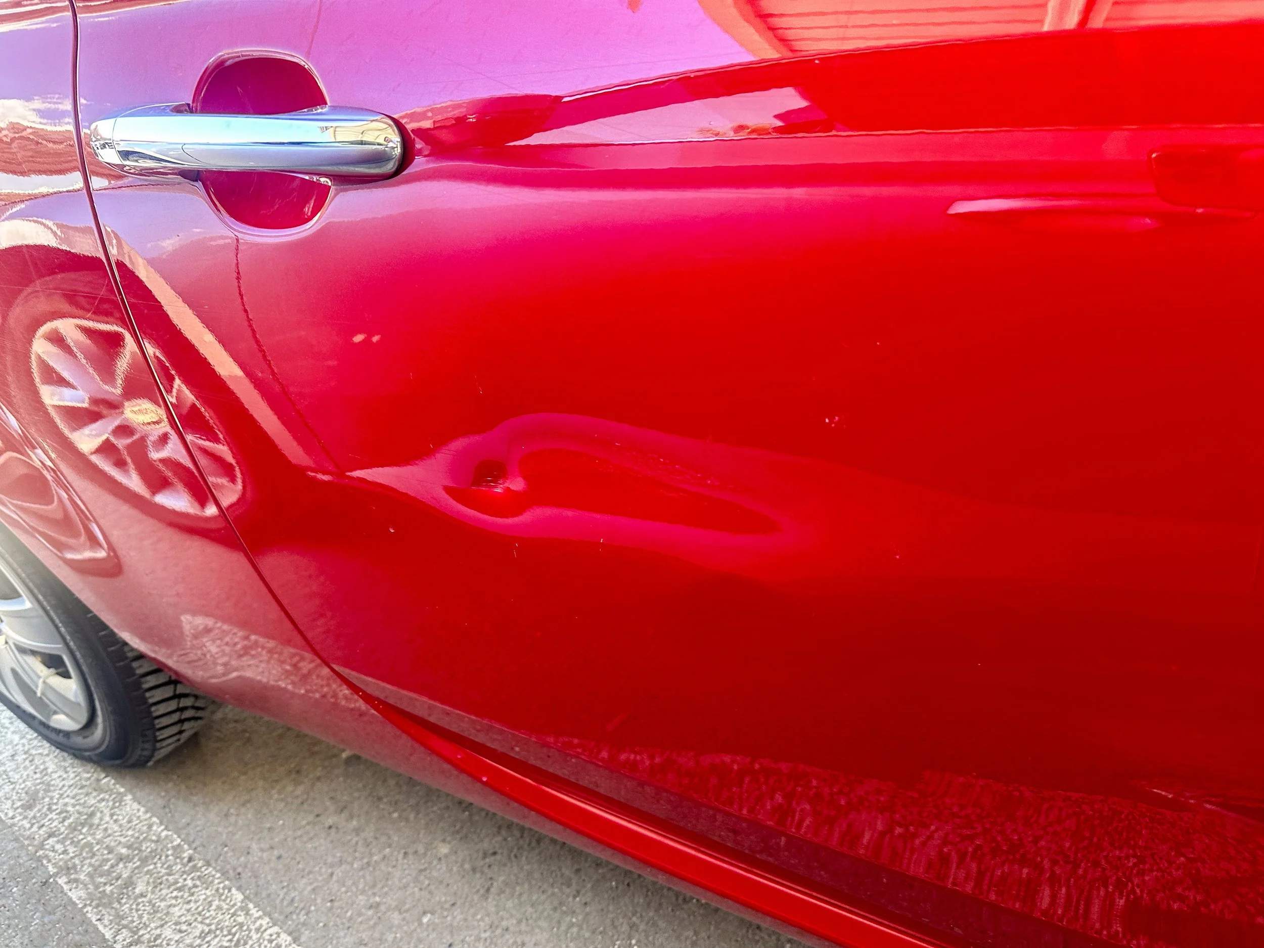 Damaged door on car rental at Tirana Airport.jpg