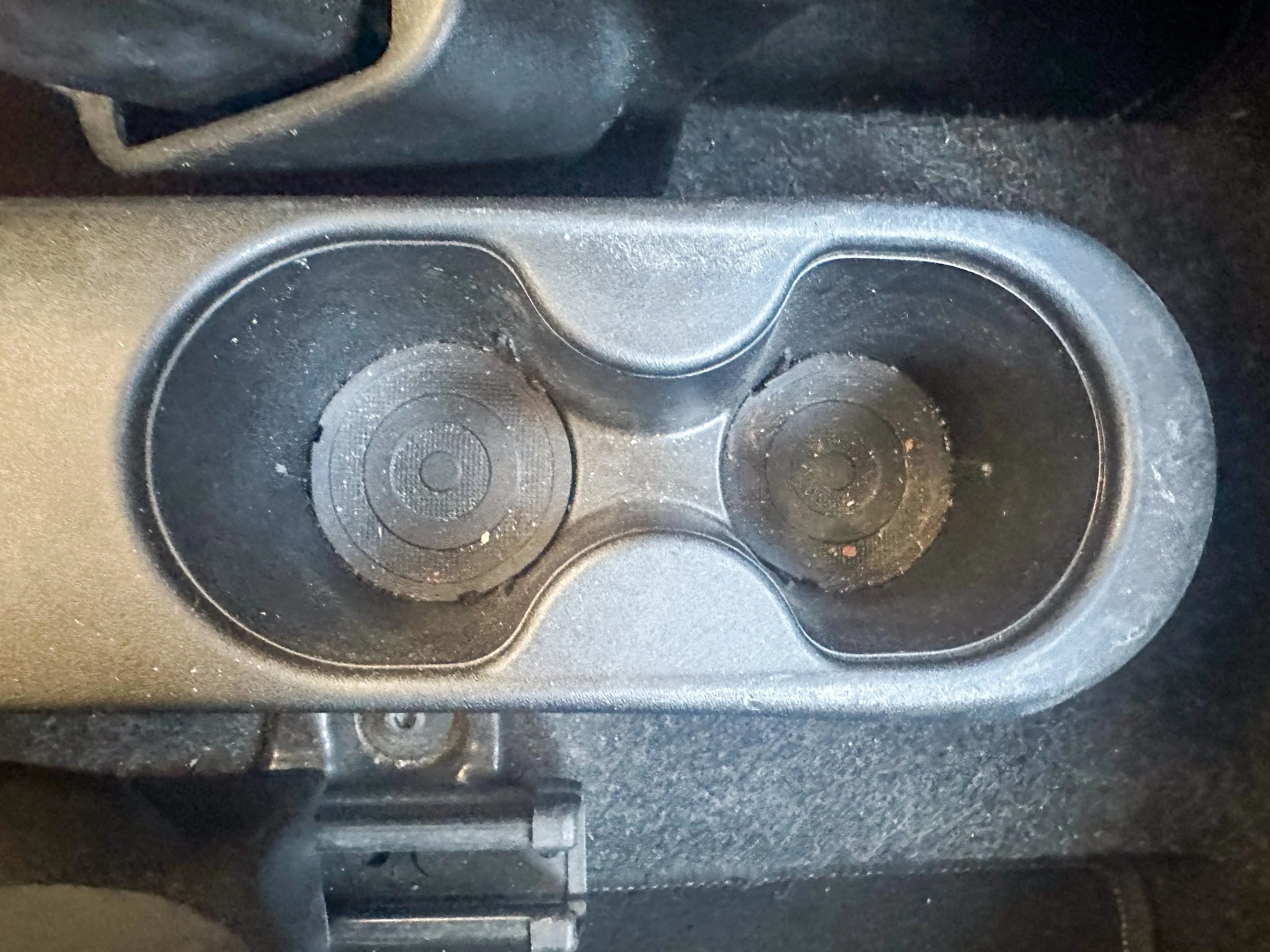 Dirty cup holder inside car rental at Tirana Airport.jpg