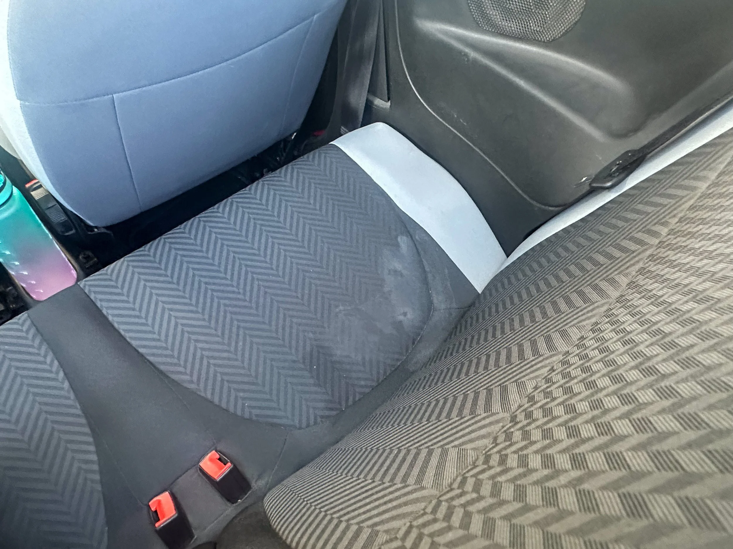 Stained seat inside car rental at Tirana Airport.jpg