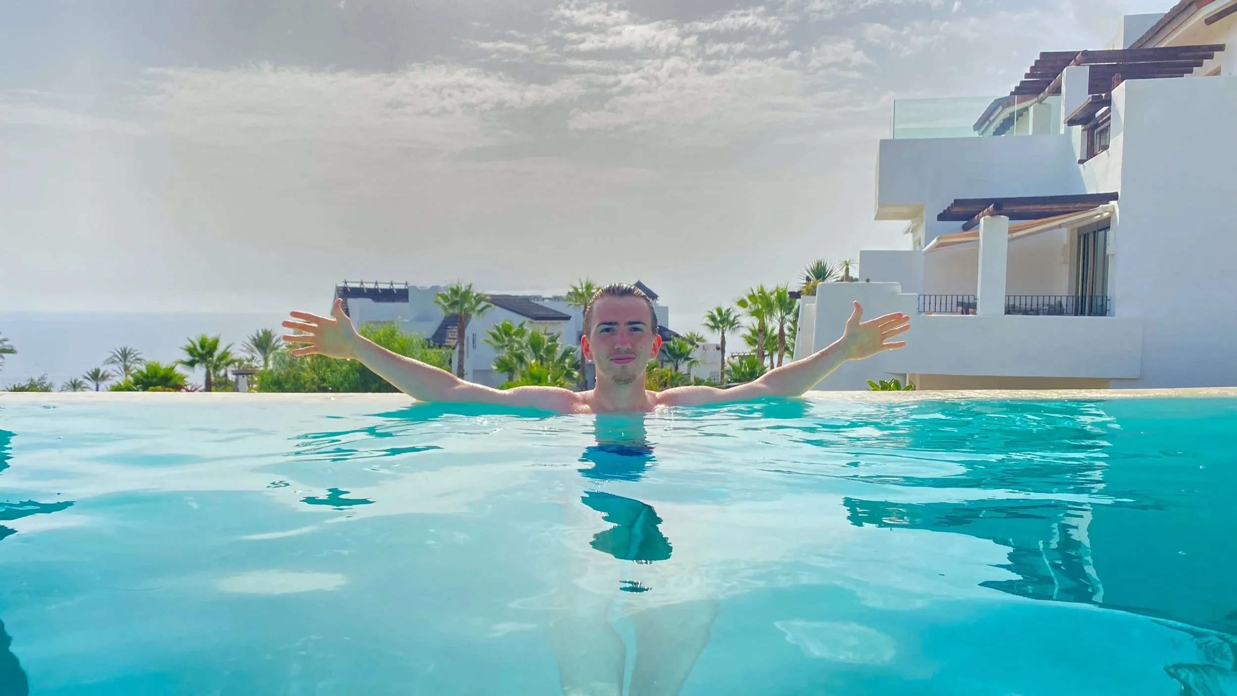 Max in infinity pool with views to the ocean, Tenerife
