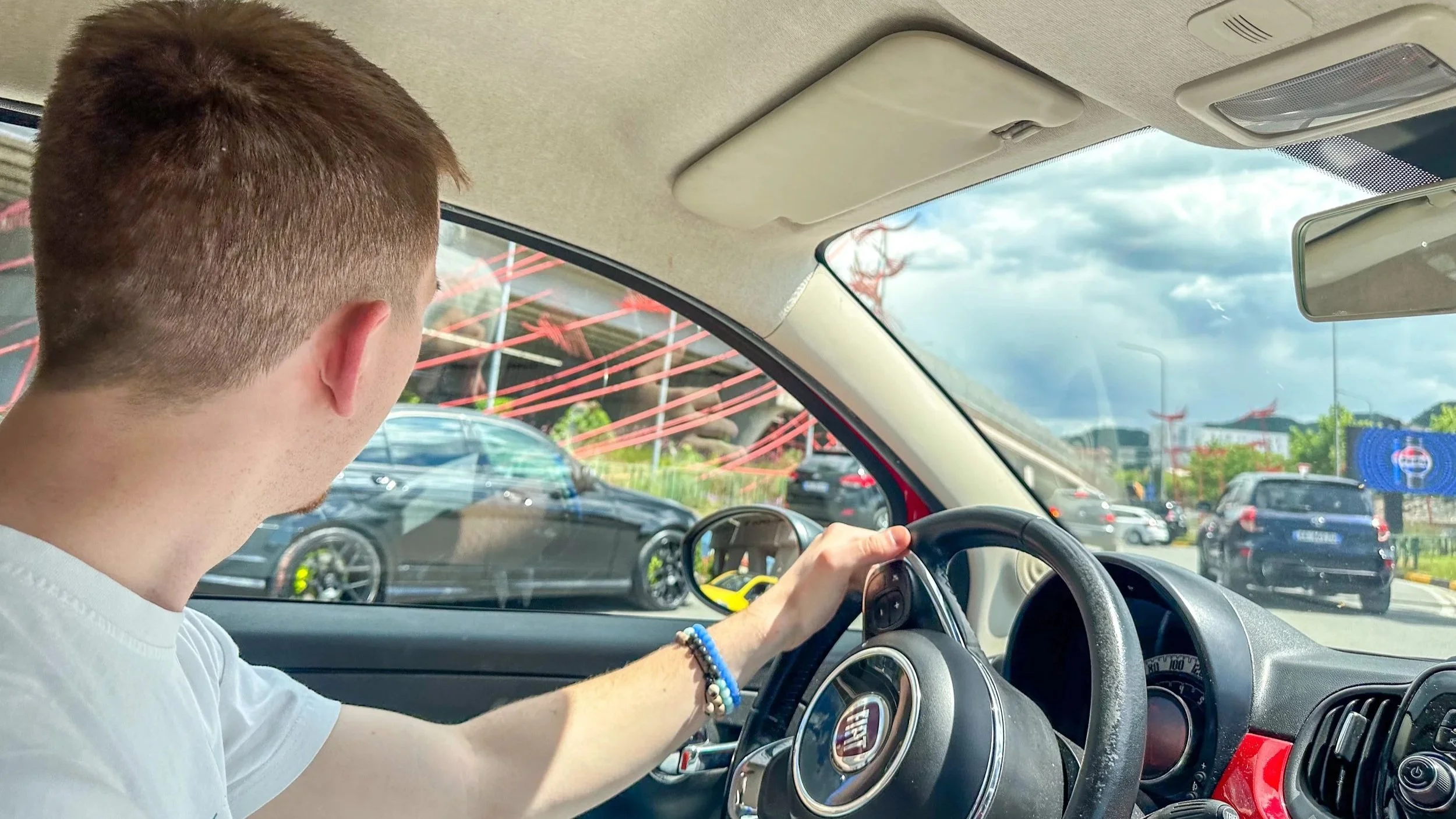 Max driving a car rental in Tirana, Albania