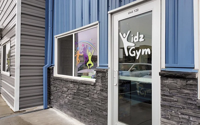 Kids Gym exterior door with branding stickers
