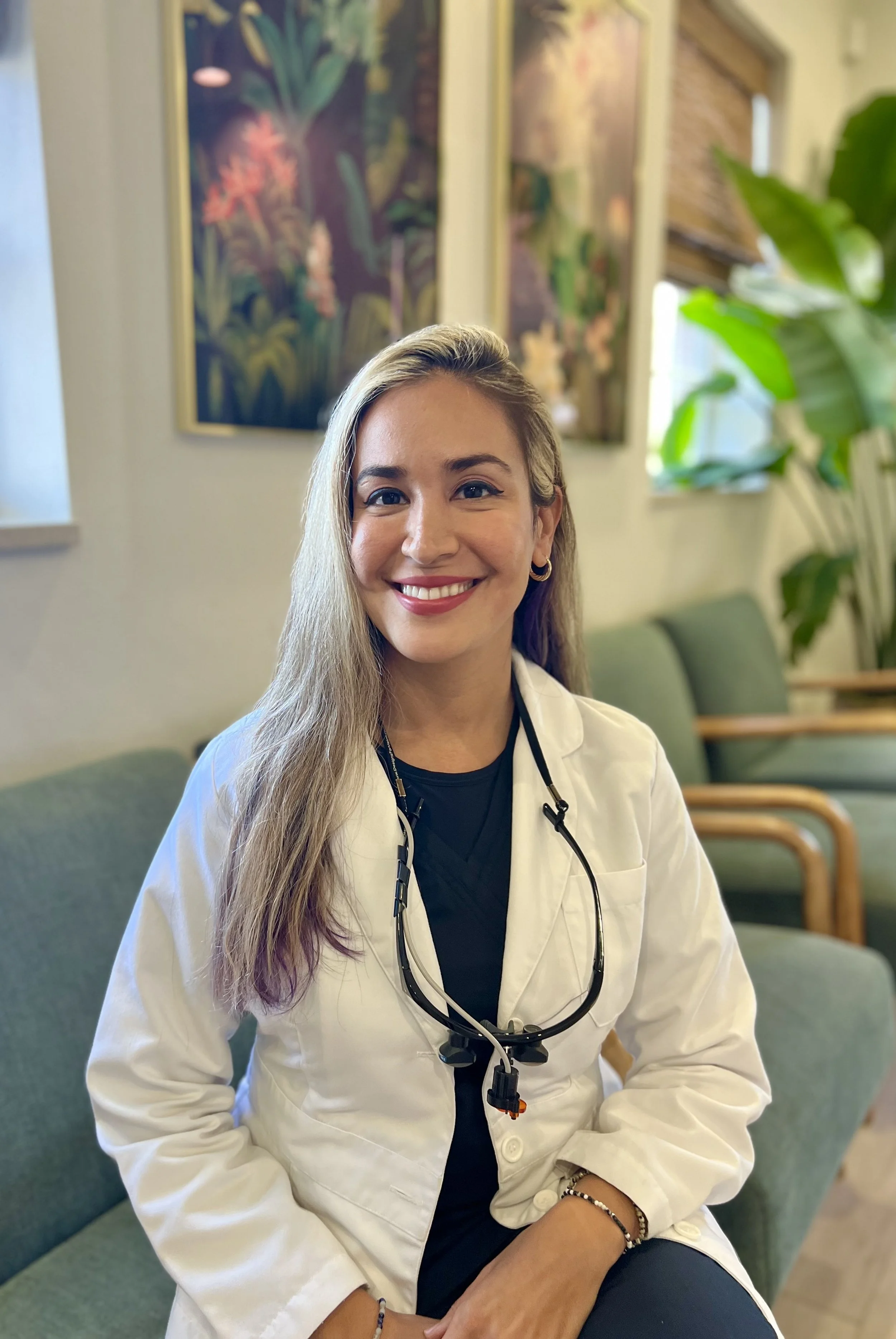 Dr. Gina sitting in a chair