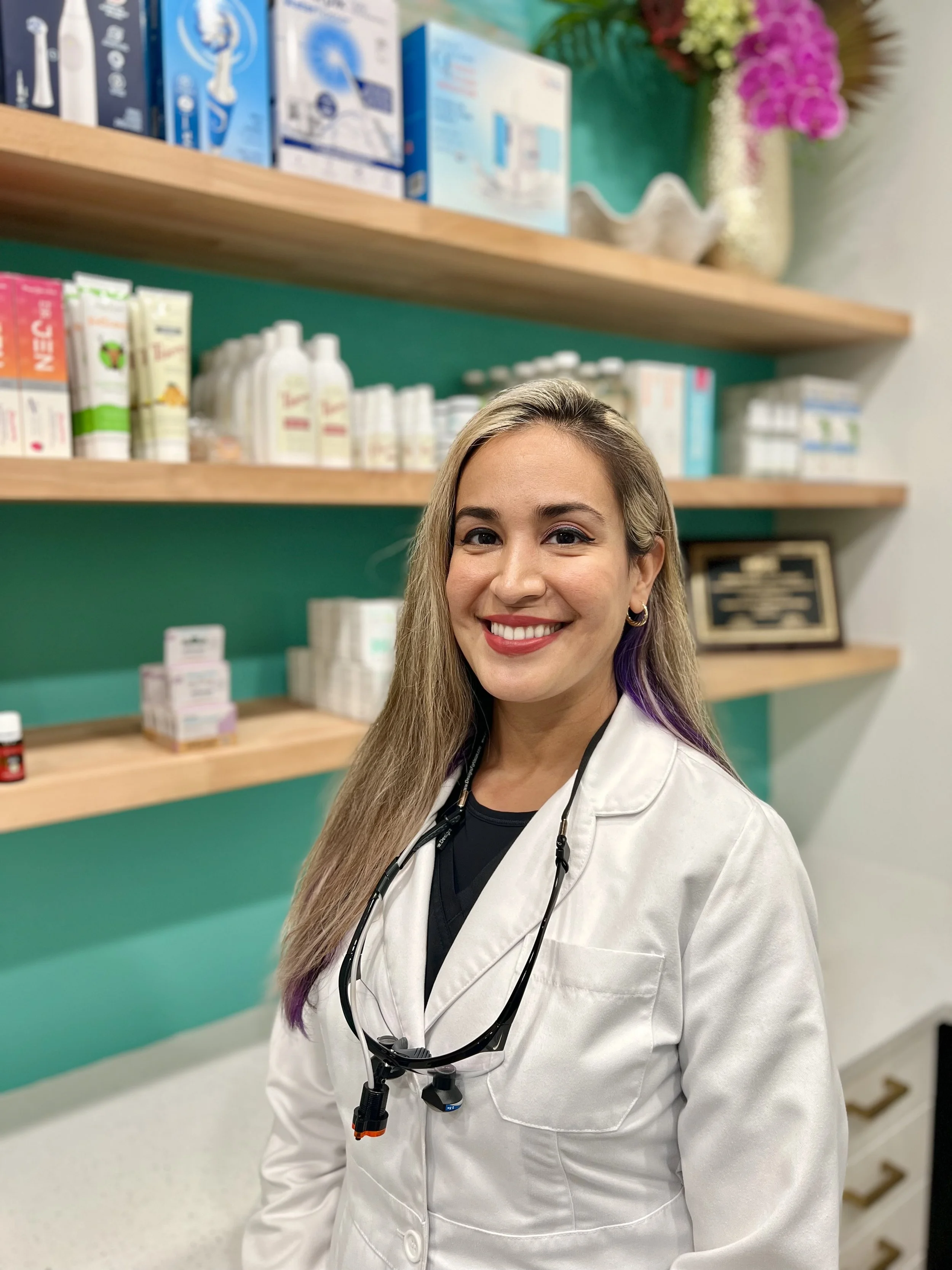 Dentist in front of vitamins