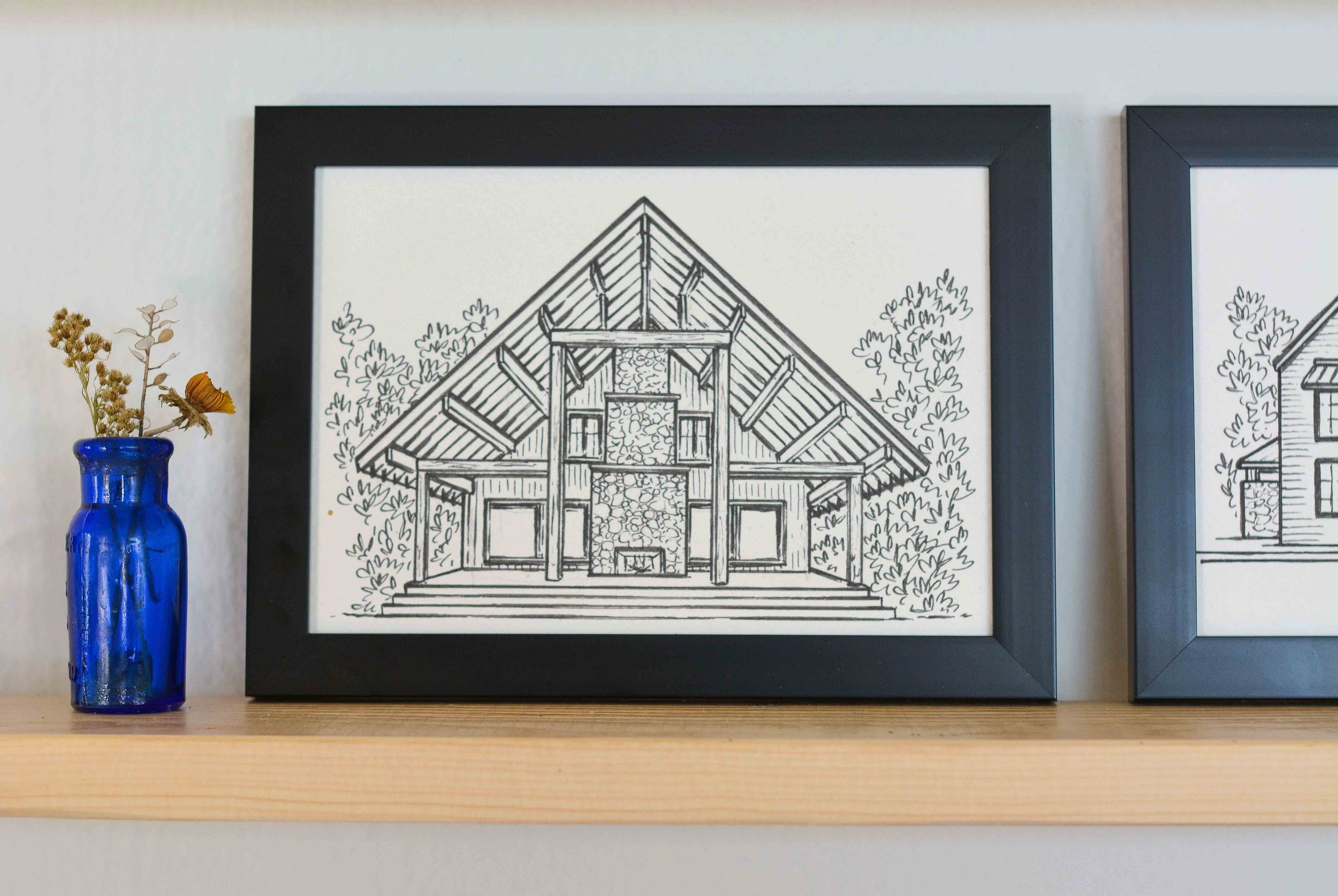 Architectural house sketch of an A-Frame. The cabin features a fireplace on the patio which is featured and beautifully hand drawn with care to detail the stone.