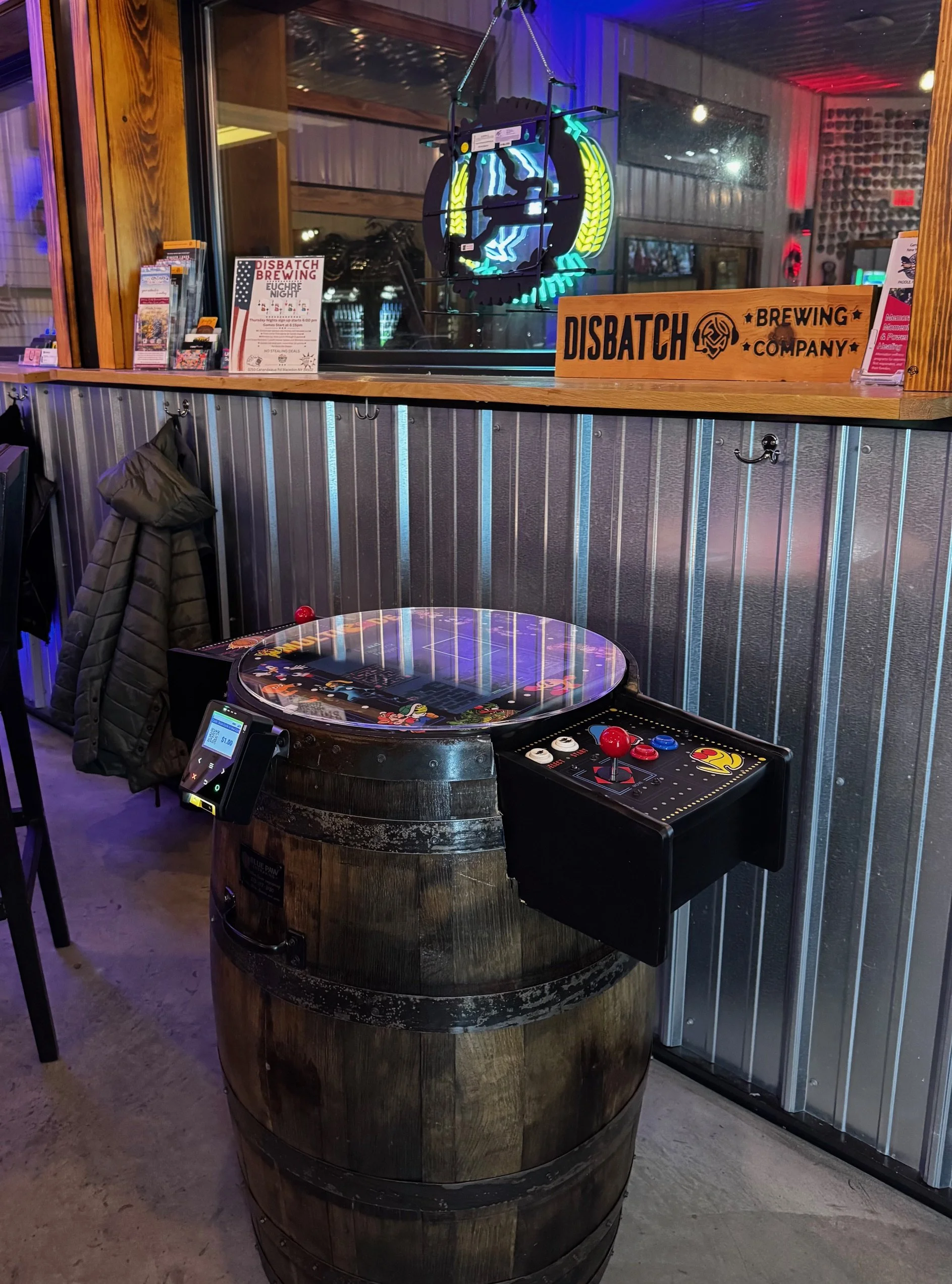 Barrel cabinet arcade cabinet/game located in Disbatch Brewery for public play