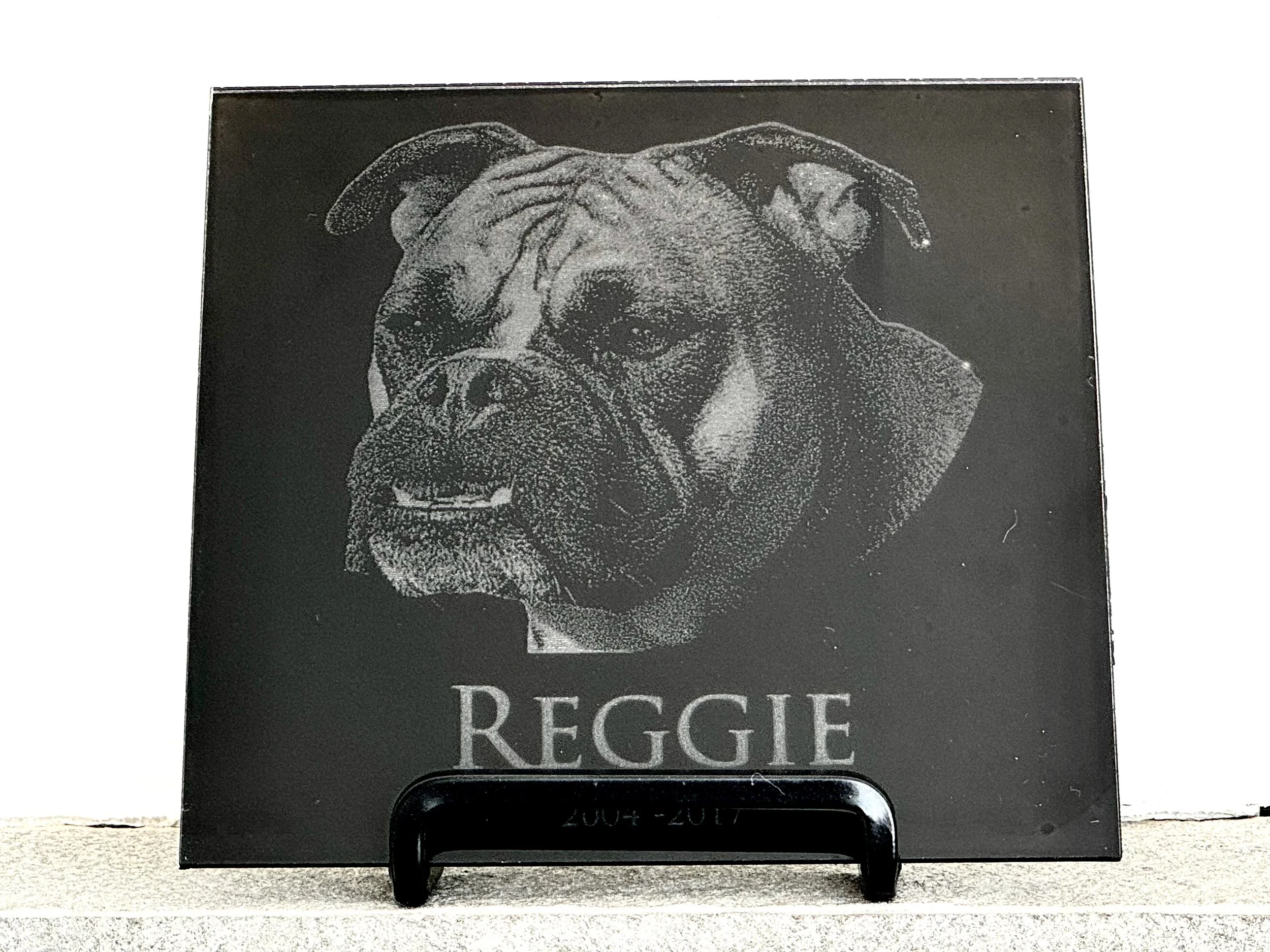 Square granite tile engraved with a bulldog and the name Reggie