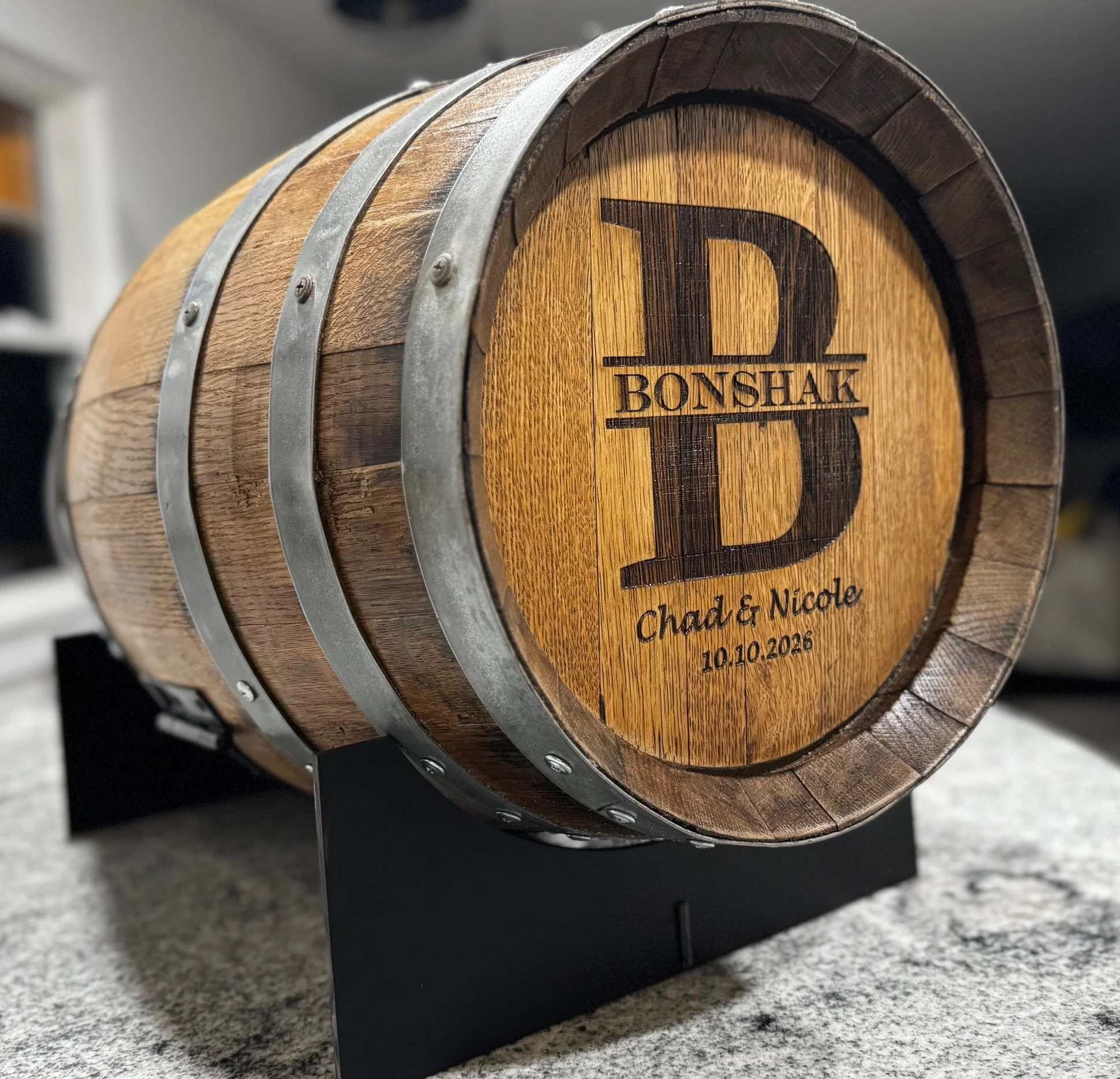 Wine barrel card holder for wedding engraved with the couples last name.