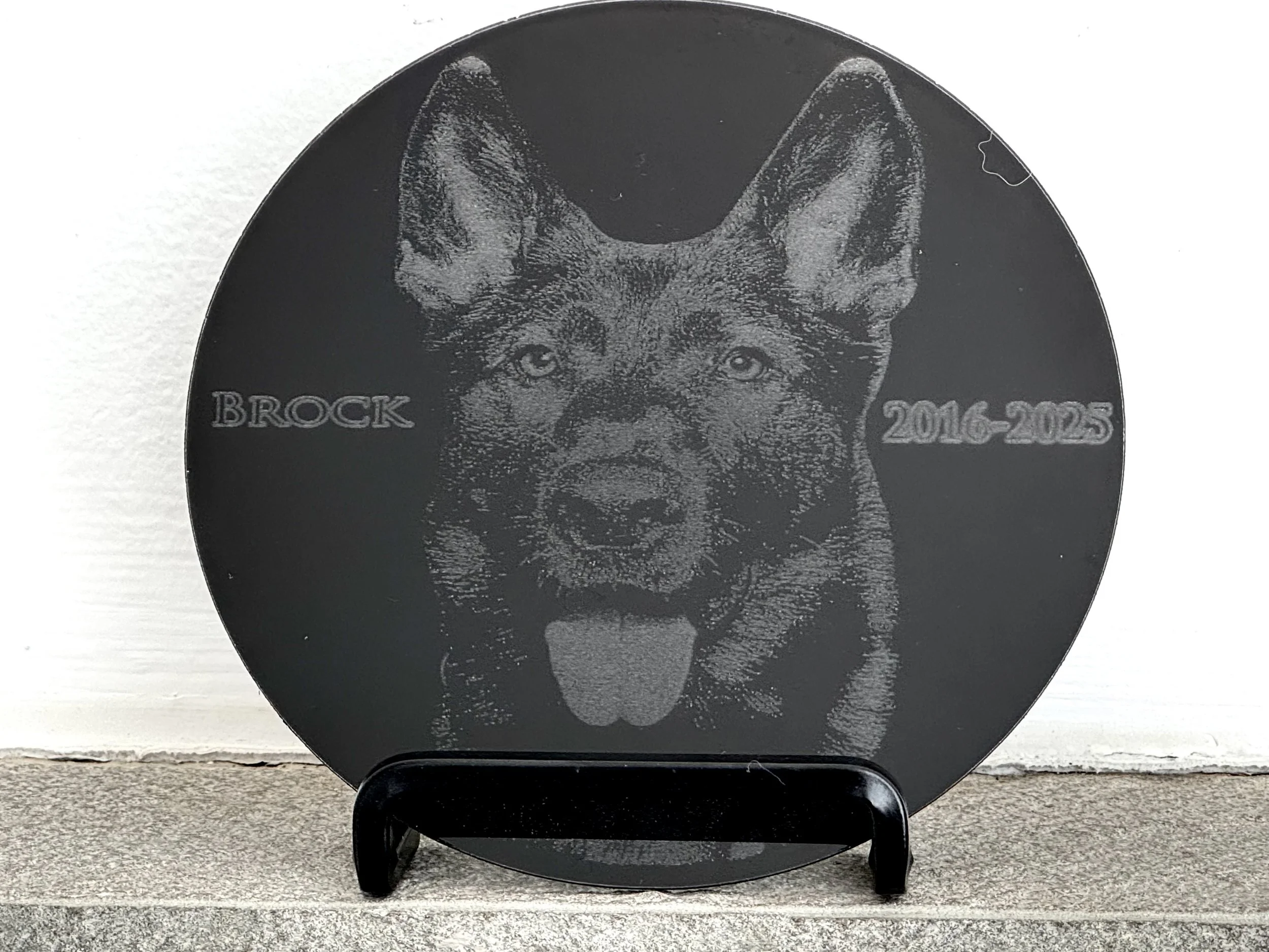 Round Granite Tile engraved with a Sheppard with the name Brock and dates