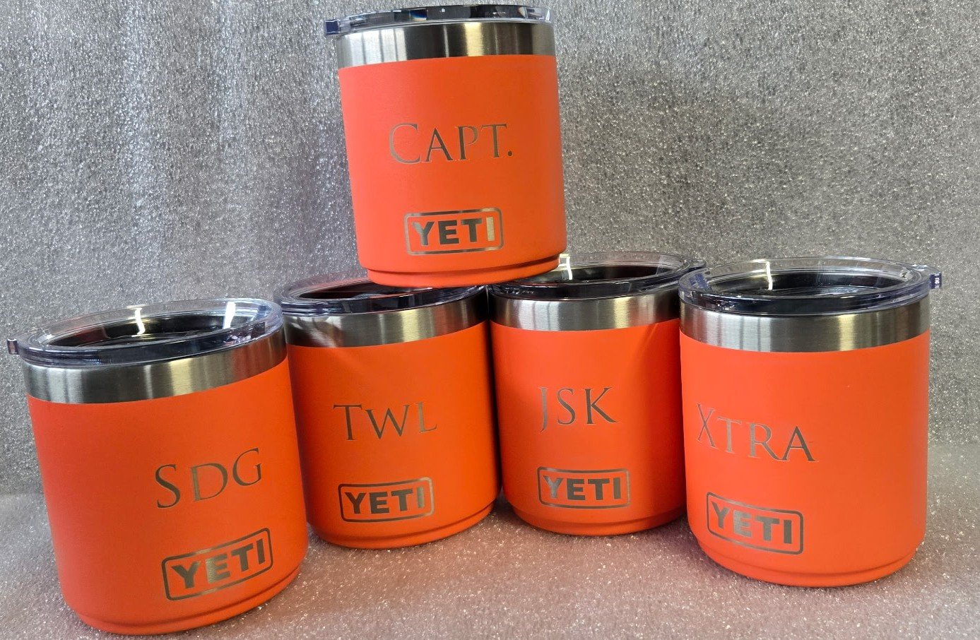 Yeti tumbler cups engraved with initials and the outline of lake ontario