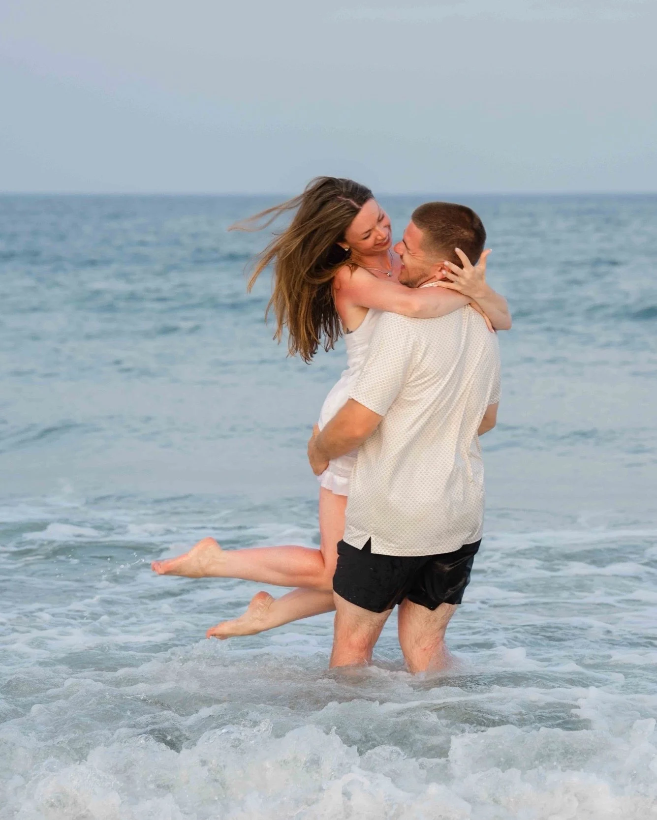 M &amp; S's session at Hampton Beach coincided with their annual family vacation, so the champagne was ready to pop and the good energy was already there! M had a vision for their session to be full of lots of movement &amp; really romantic vibes whi