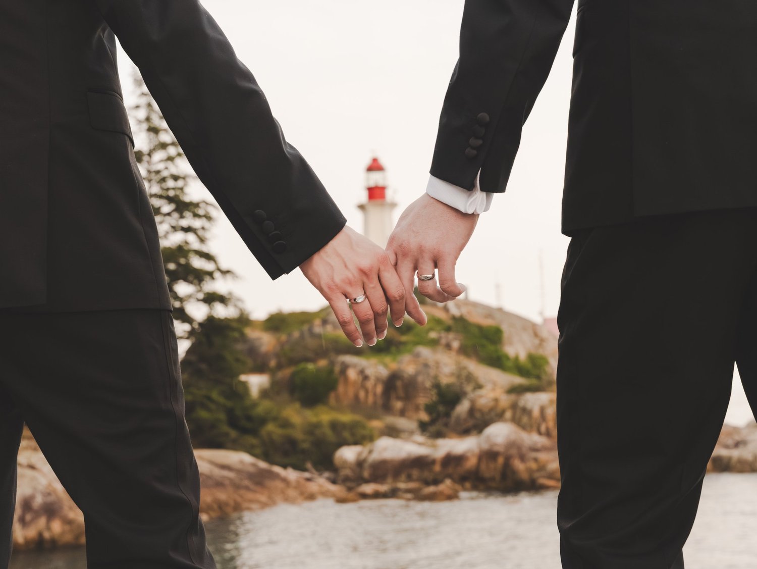 Engagement session detail with lighthouse in the background