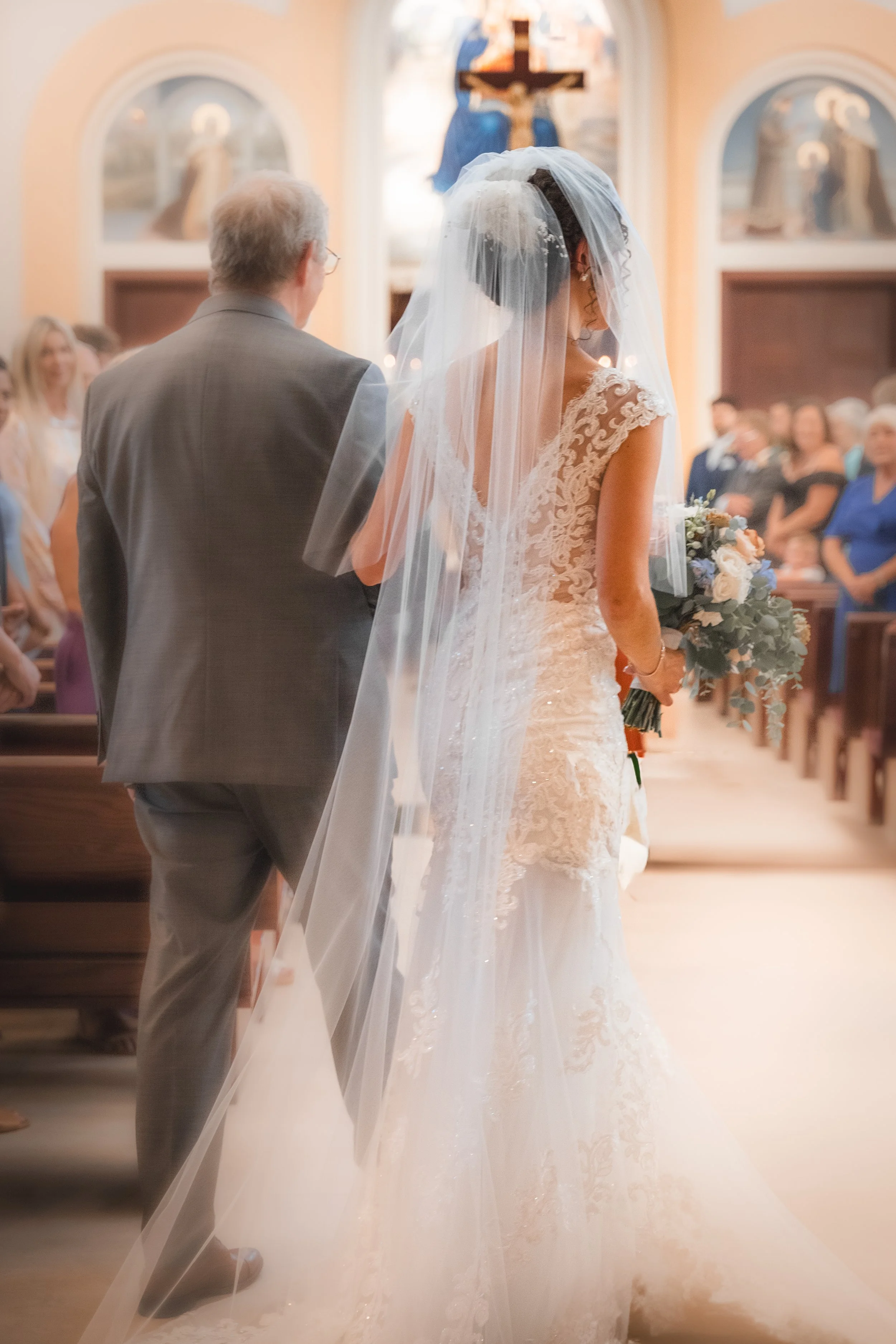 F/2.0 — The Anticipation

Trailing lace and quiet steps captured in the stillness before the vows.
