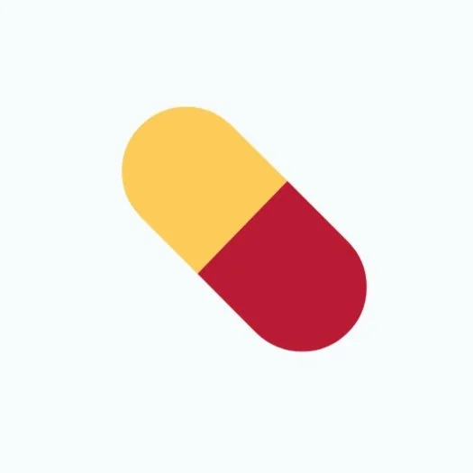 A capsule-shaped pill with yellow and red halves on a light background.