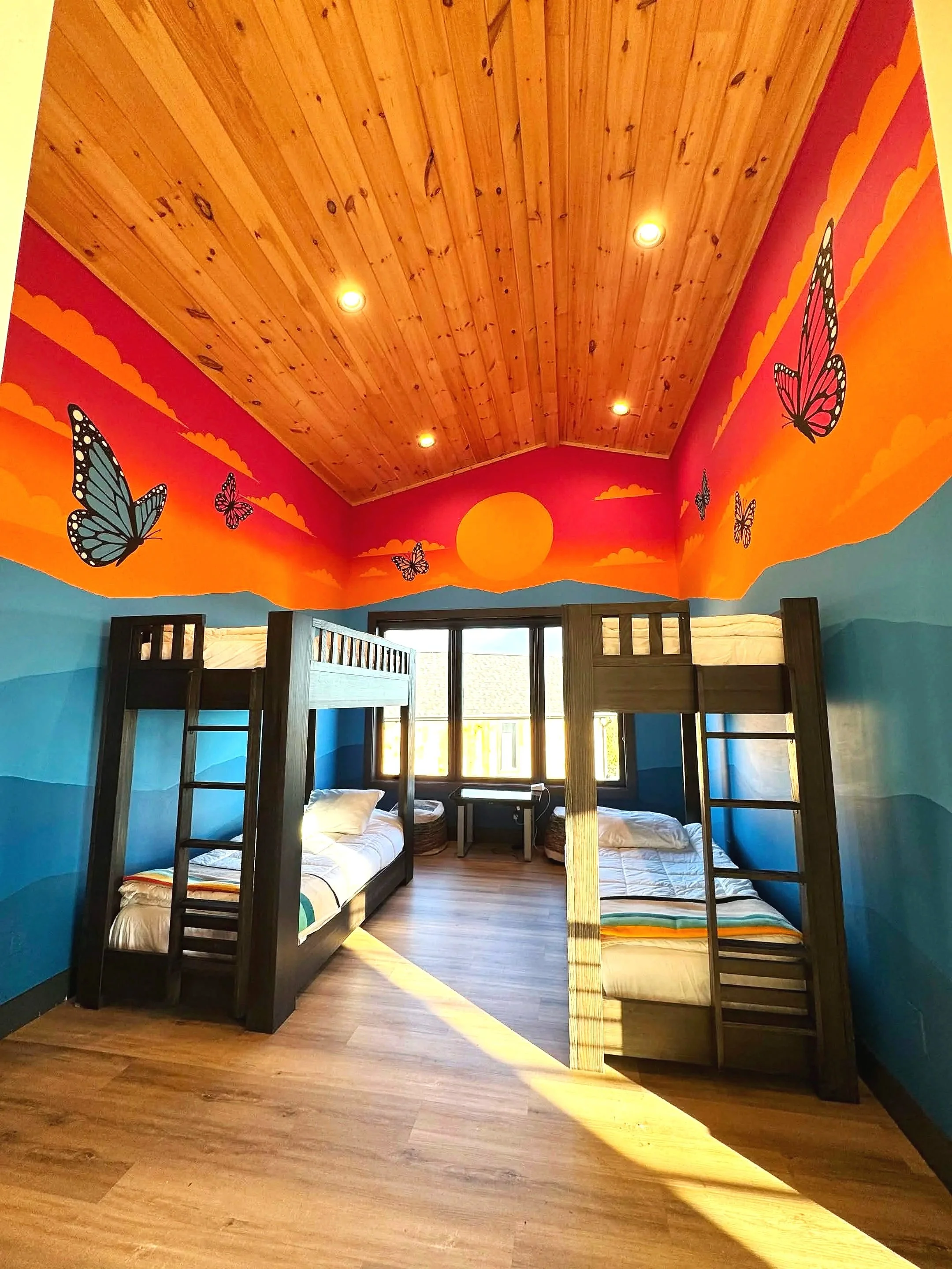 Sunset butterfly cabin mural at a Sevierville Tennessee Airbnb by Sarah Meitler Murals