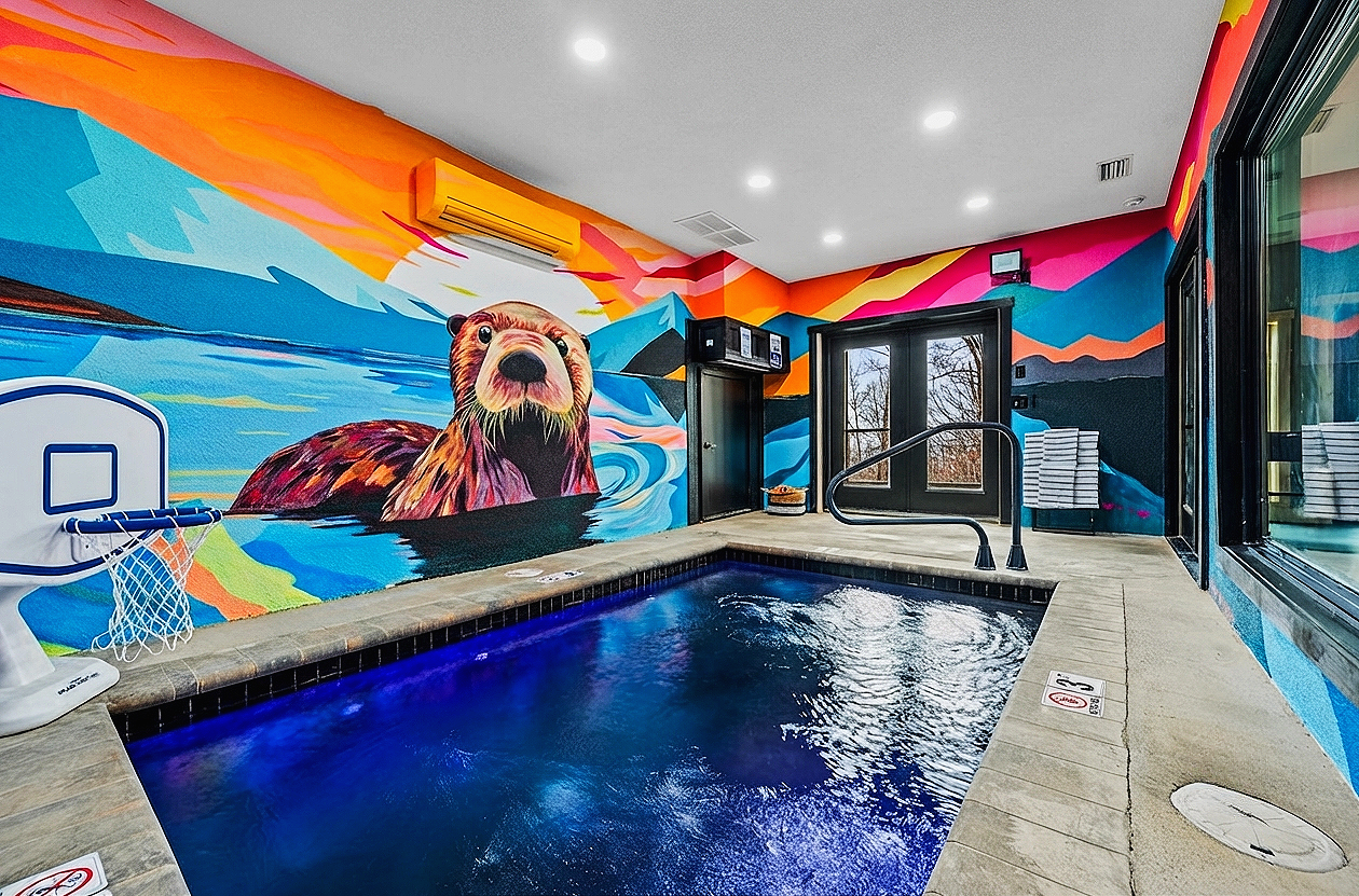 Playful otter mural near the pool area at Wet Otter Lodge Airbnb in Gatlinburg, Tennessee