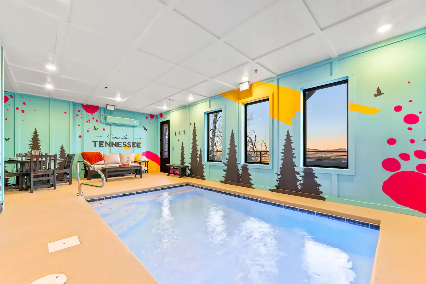 Vibrant pop-art black bear wall mural with forest silhouettes in a Smoky Mountains cabin.