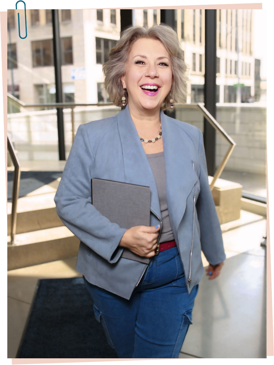 Theresa Rose walking down stairs with notebook in hand
