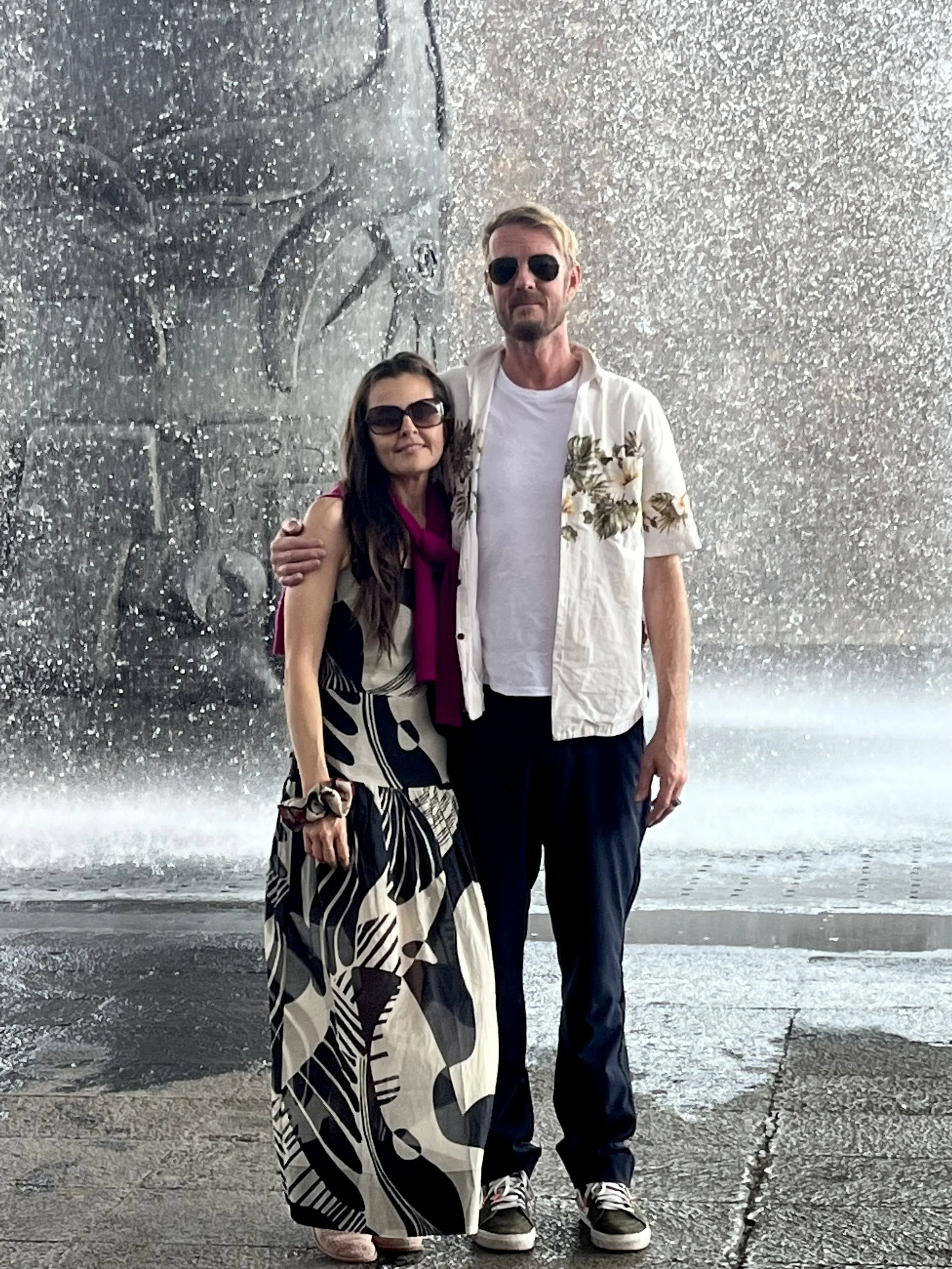 Shelley and Tait in sunglasses in front of the water sculpture at the Museum of Anthropology in Mexico City