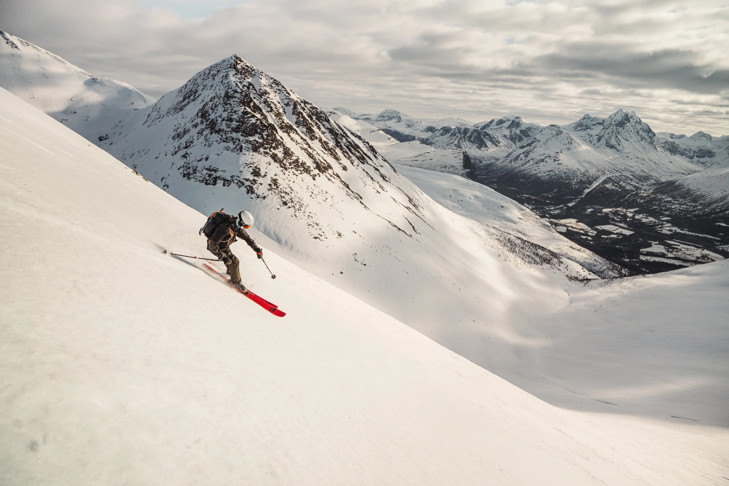 Skier on his way down a mountain in Northwest Norway