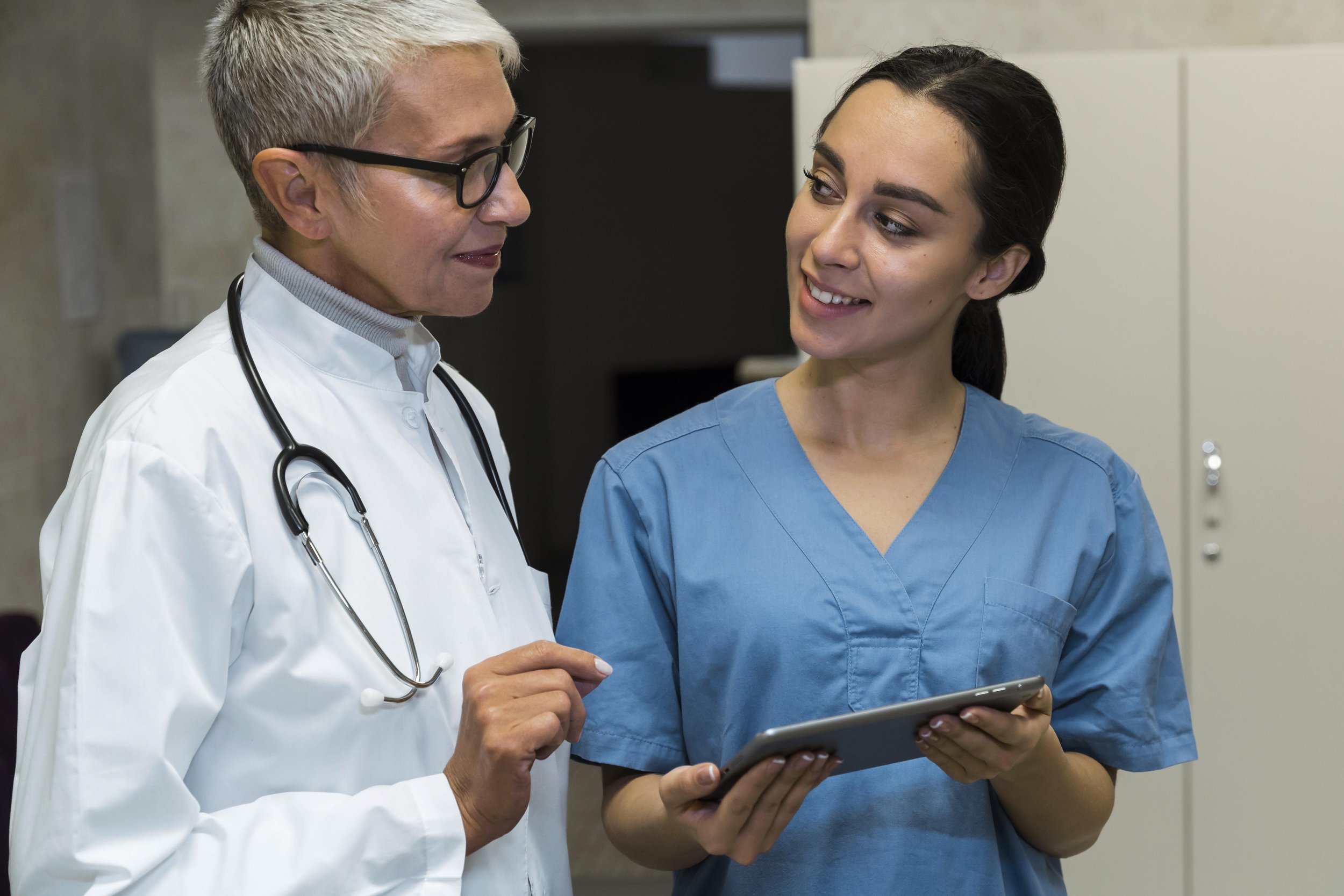 Doctor & nurse talking to each other