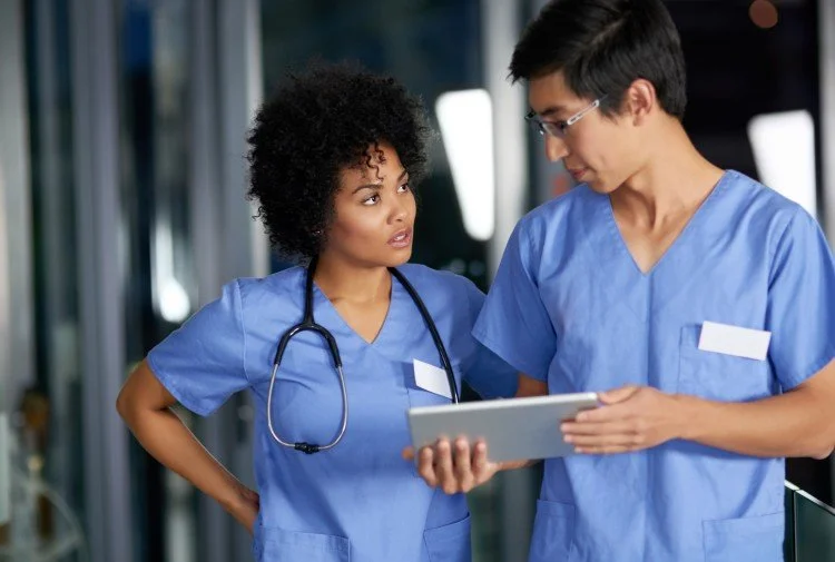 Hospital staff talking to each other
