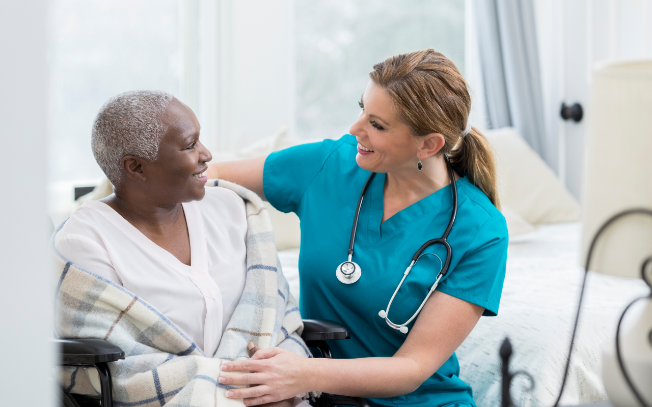 Nurse caring for sick woman.