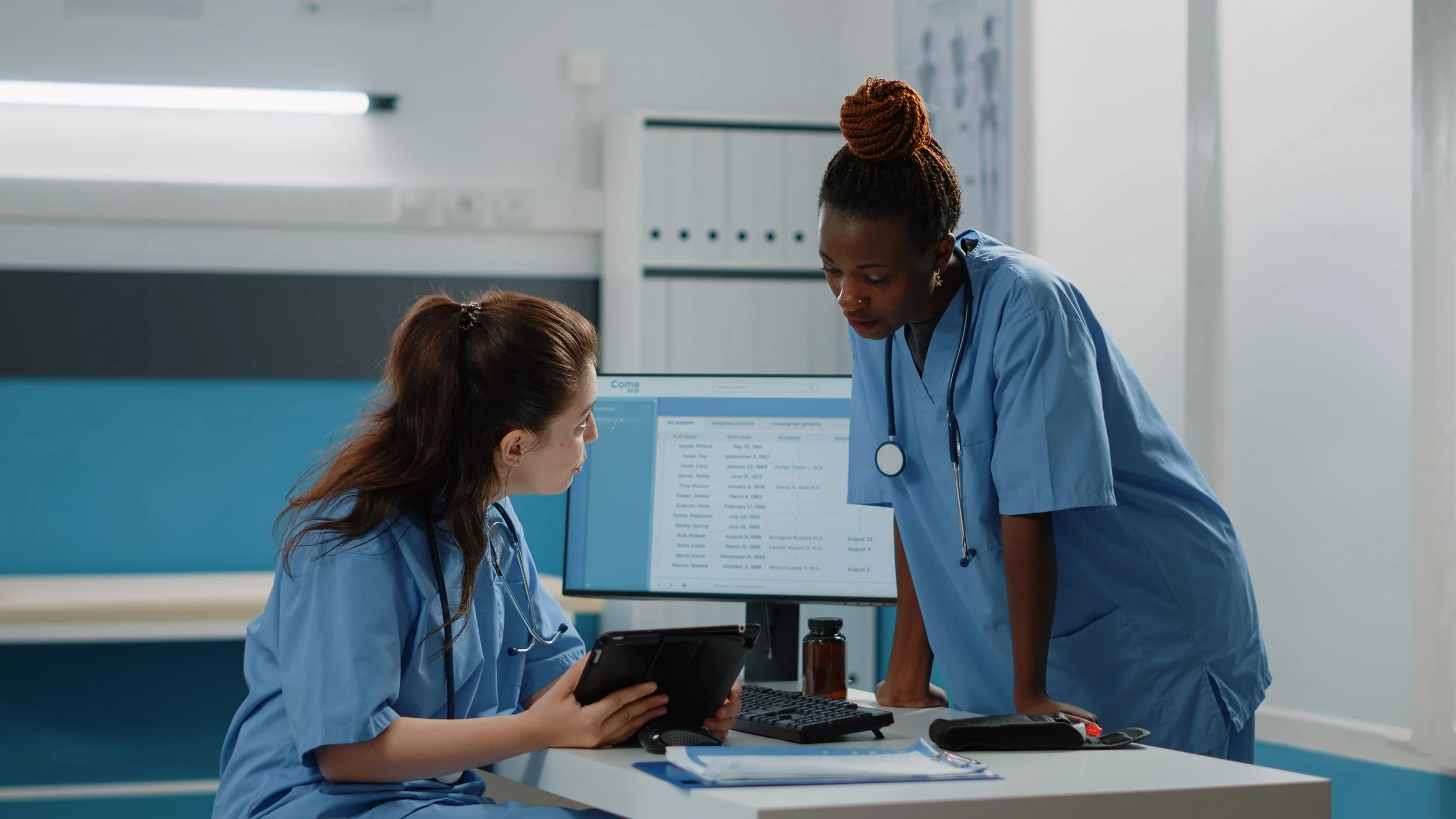 nurses checking patient records