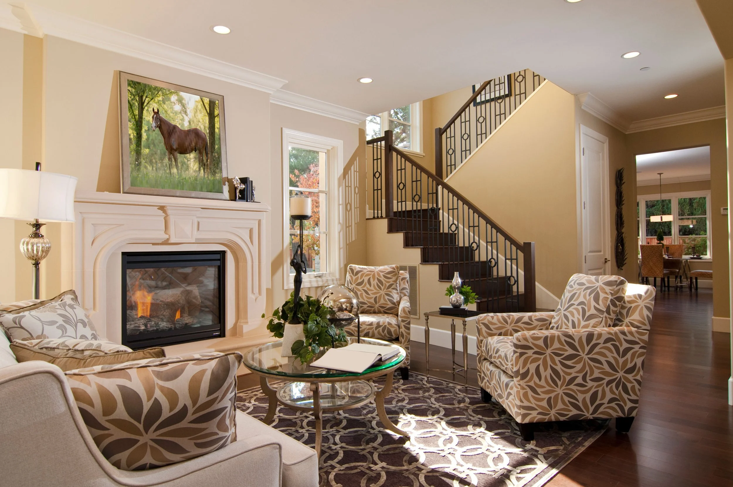 A souther traditional living room with a large scale professional framed canvas of a bay horse standing in a forested grove in Athens, GA.