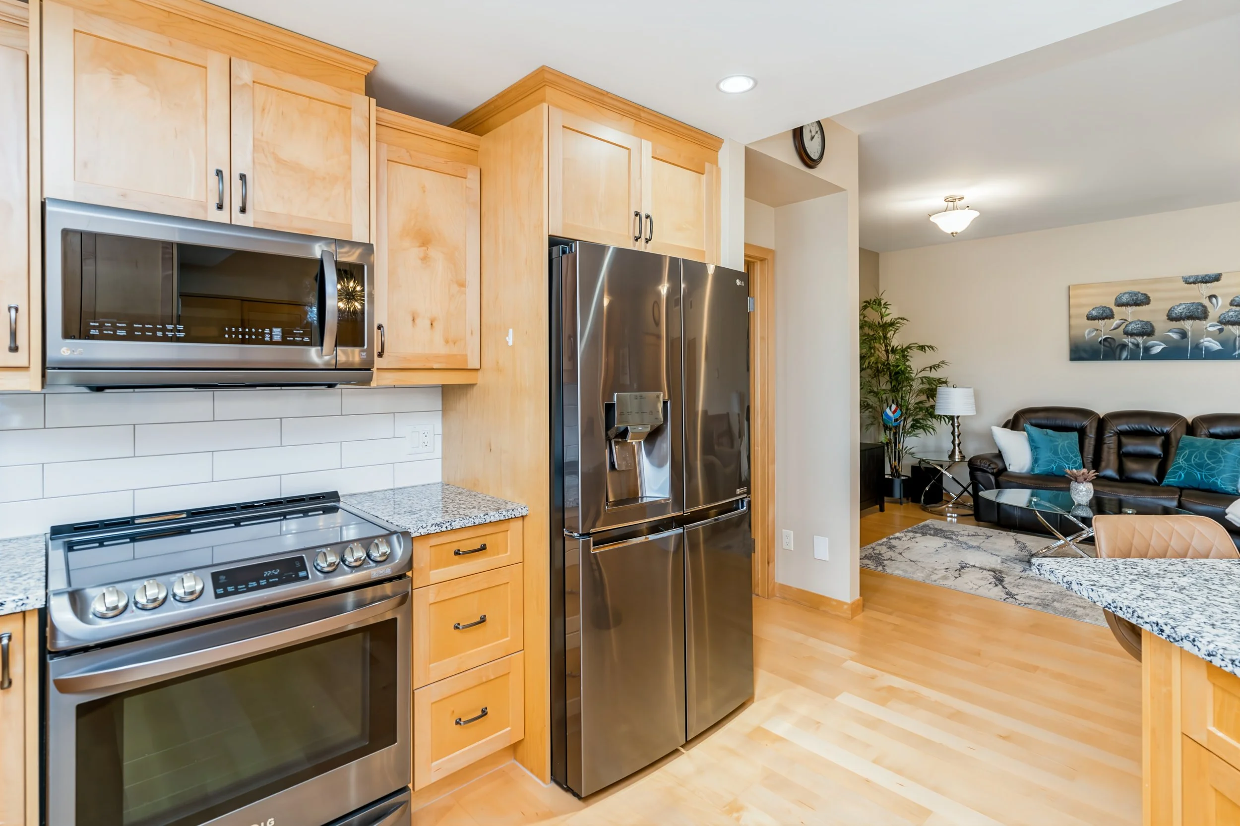 012 Bright open-concept living room in Chateau Lorette condo.jpg