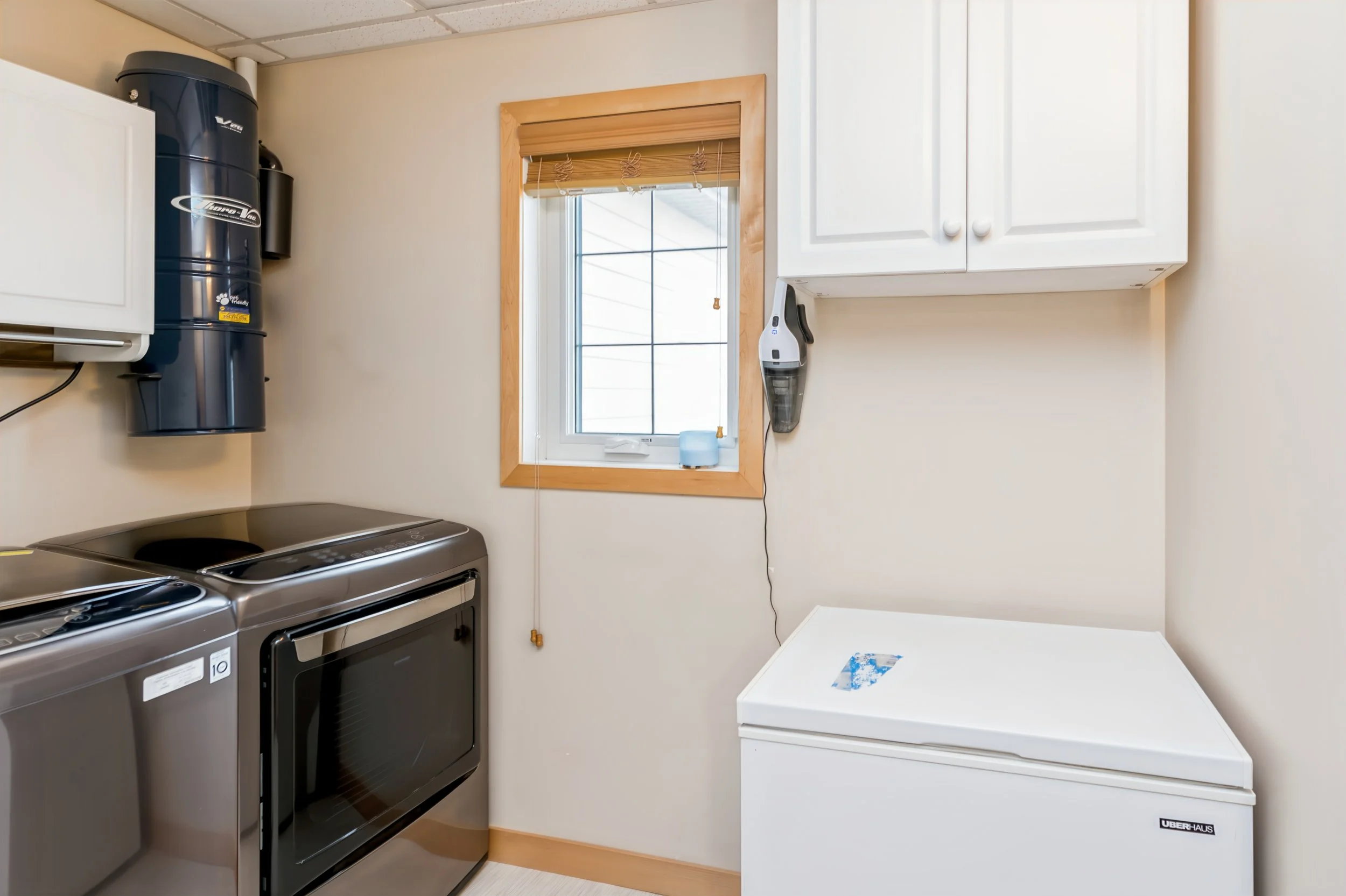 031 In-suite laundry and utility room with extra storage.jpg