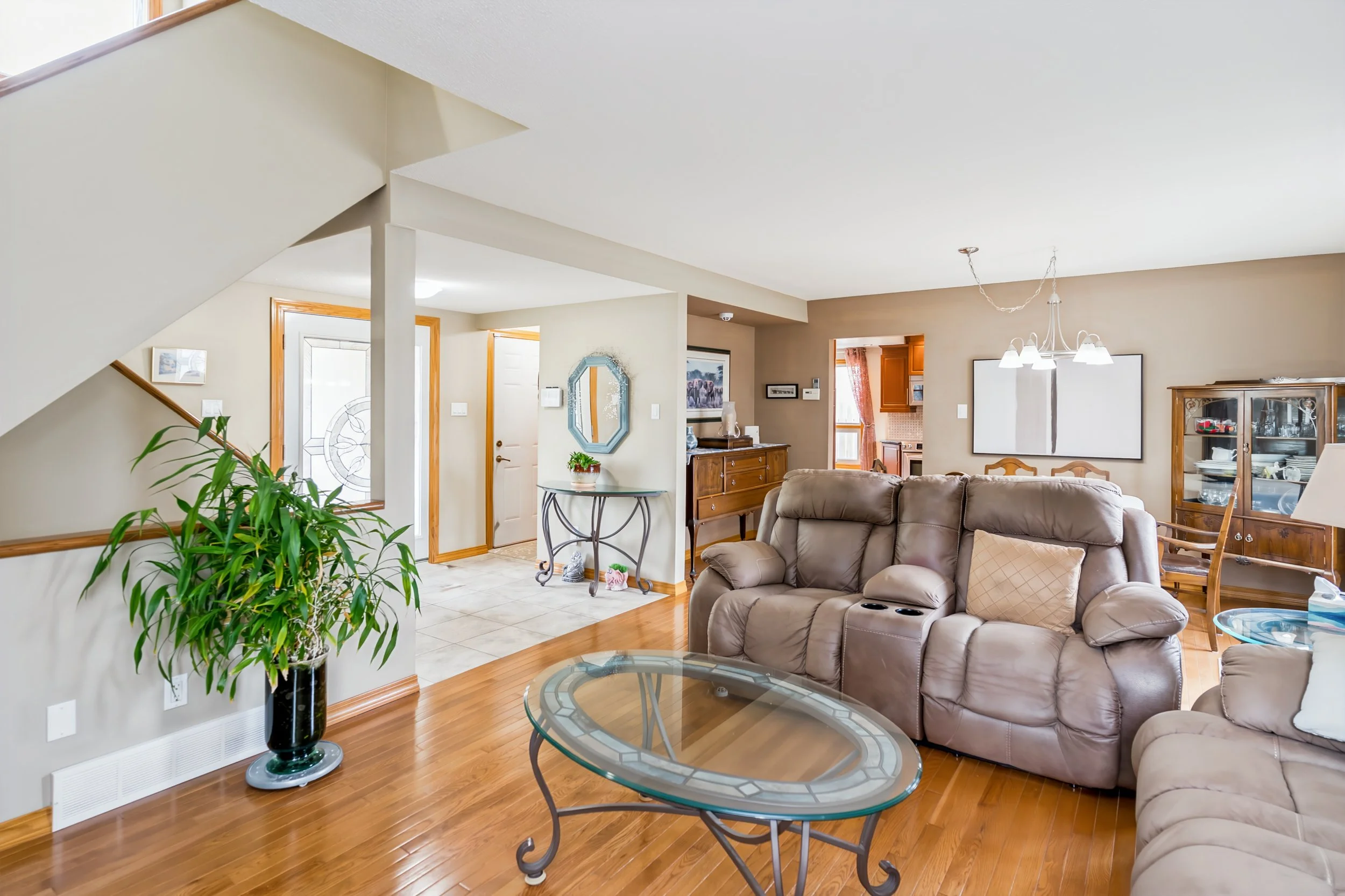 007 Open-concept living and dining area in North Kildonan Home.jpg