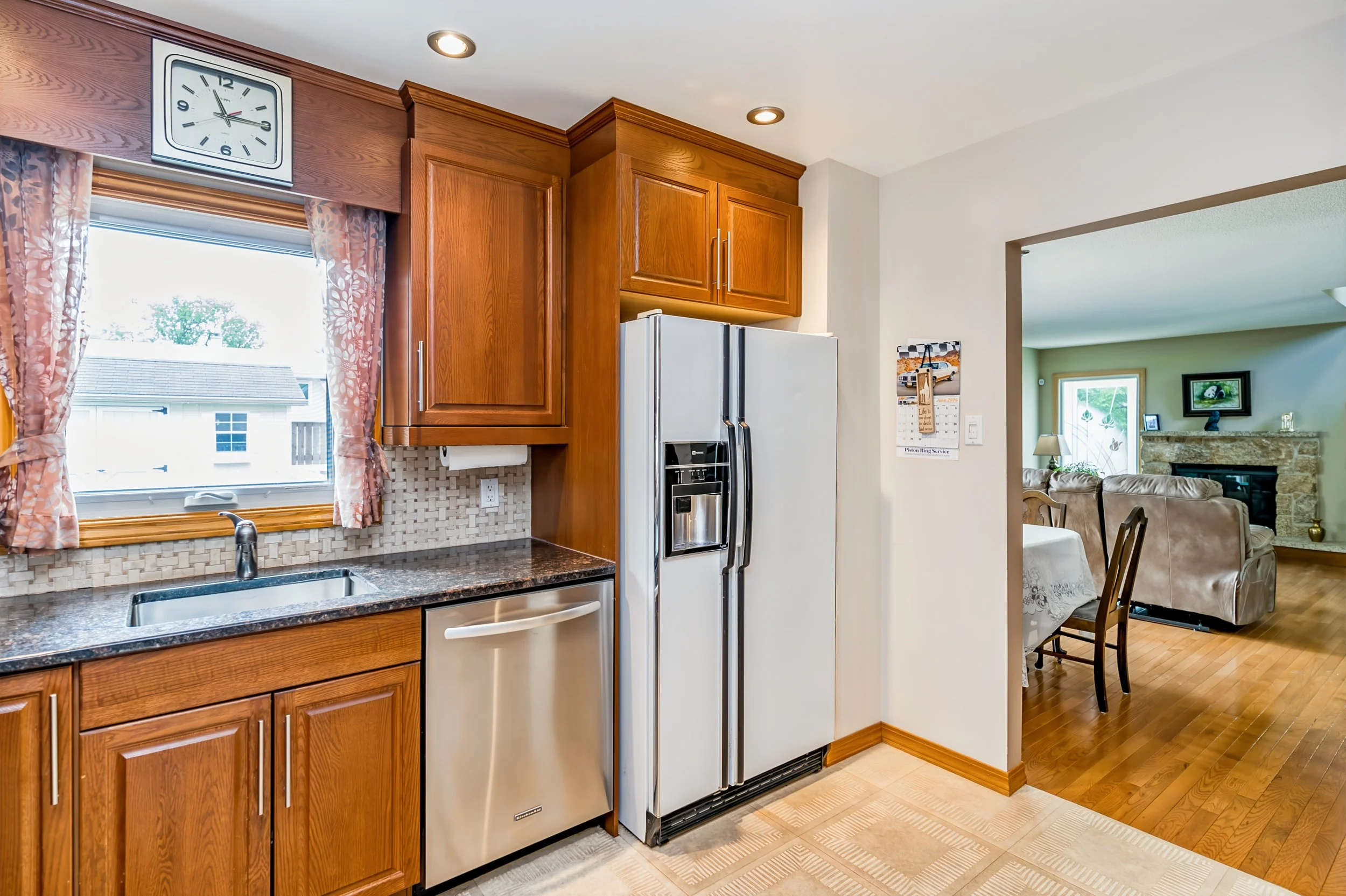 013 Updated Winnipeg kitchen with oak soft-close cabinetry and granite countertops.jpg