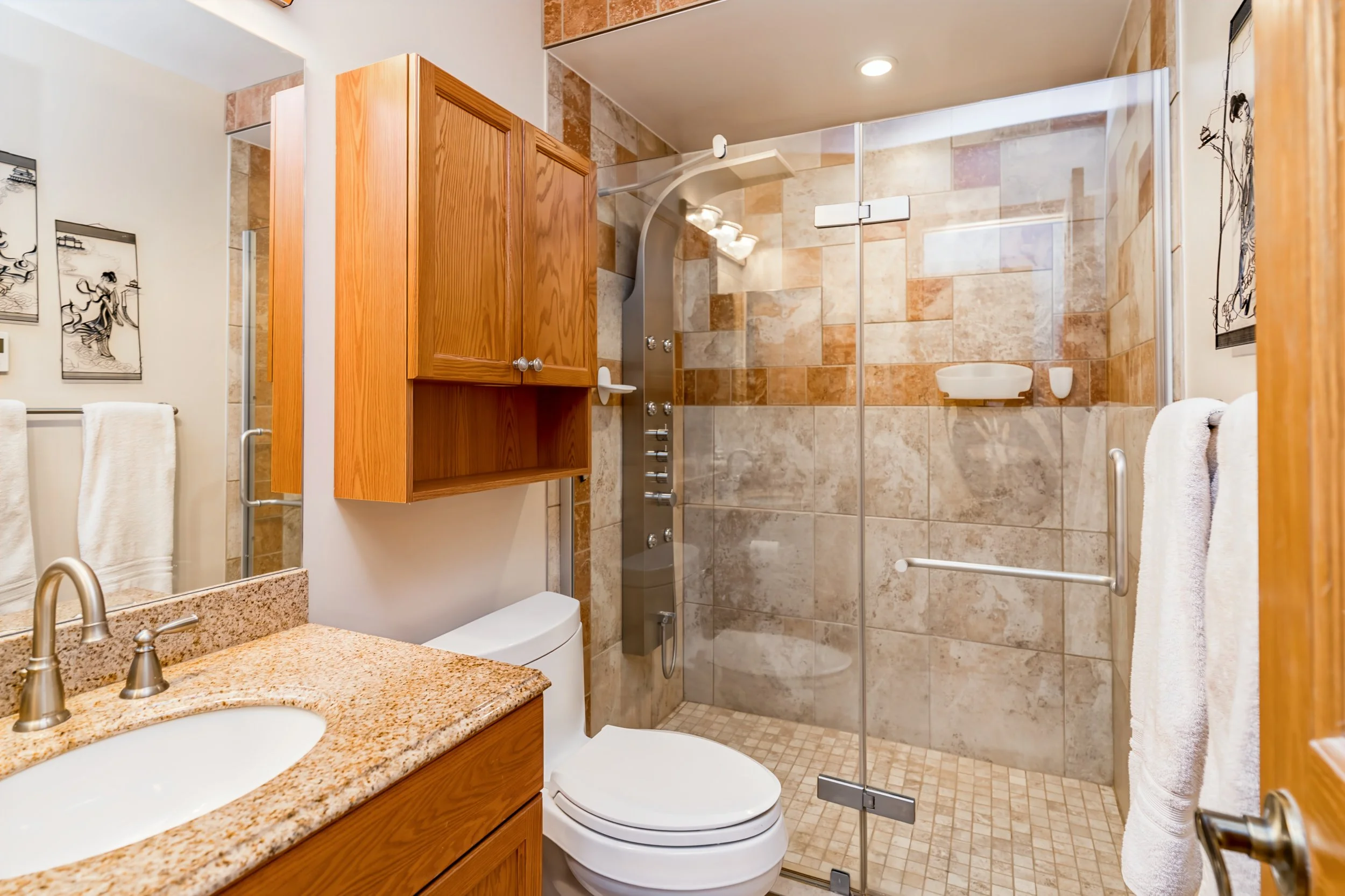 028 Updated ensuite bathroom with custom tiled shower.jpg