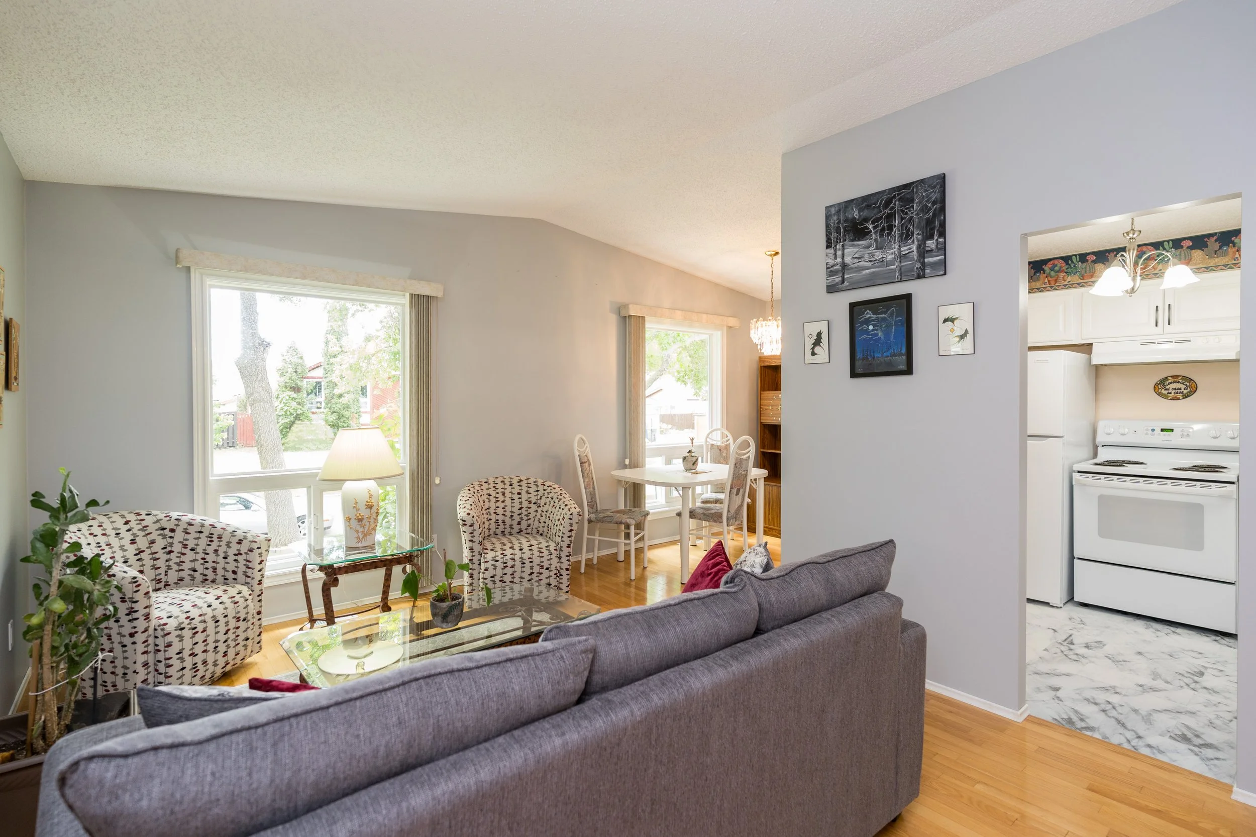 004 Bright living room with vaulted ceilings in Transcona.jpg