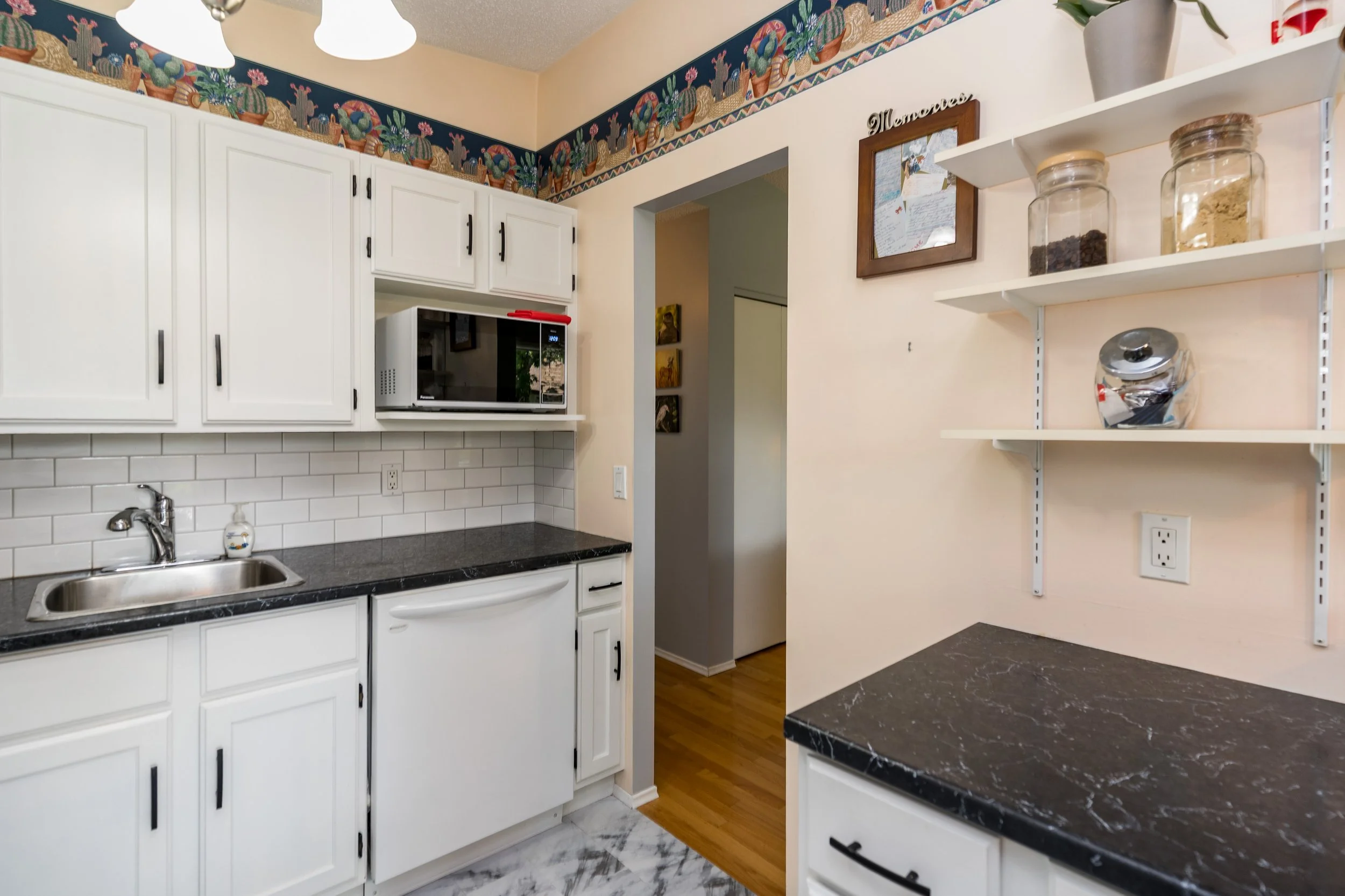 011 White kitchen cabinetry in Canterbury Park Winnipeg.jpg