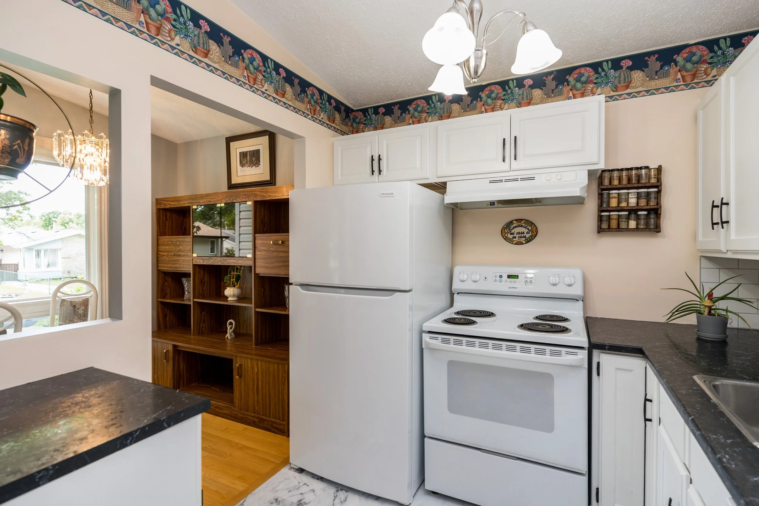 013 Fresh kitchen design with updated appliances and white cabinetry.jpg